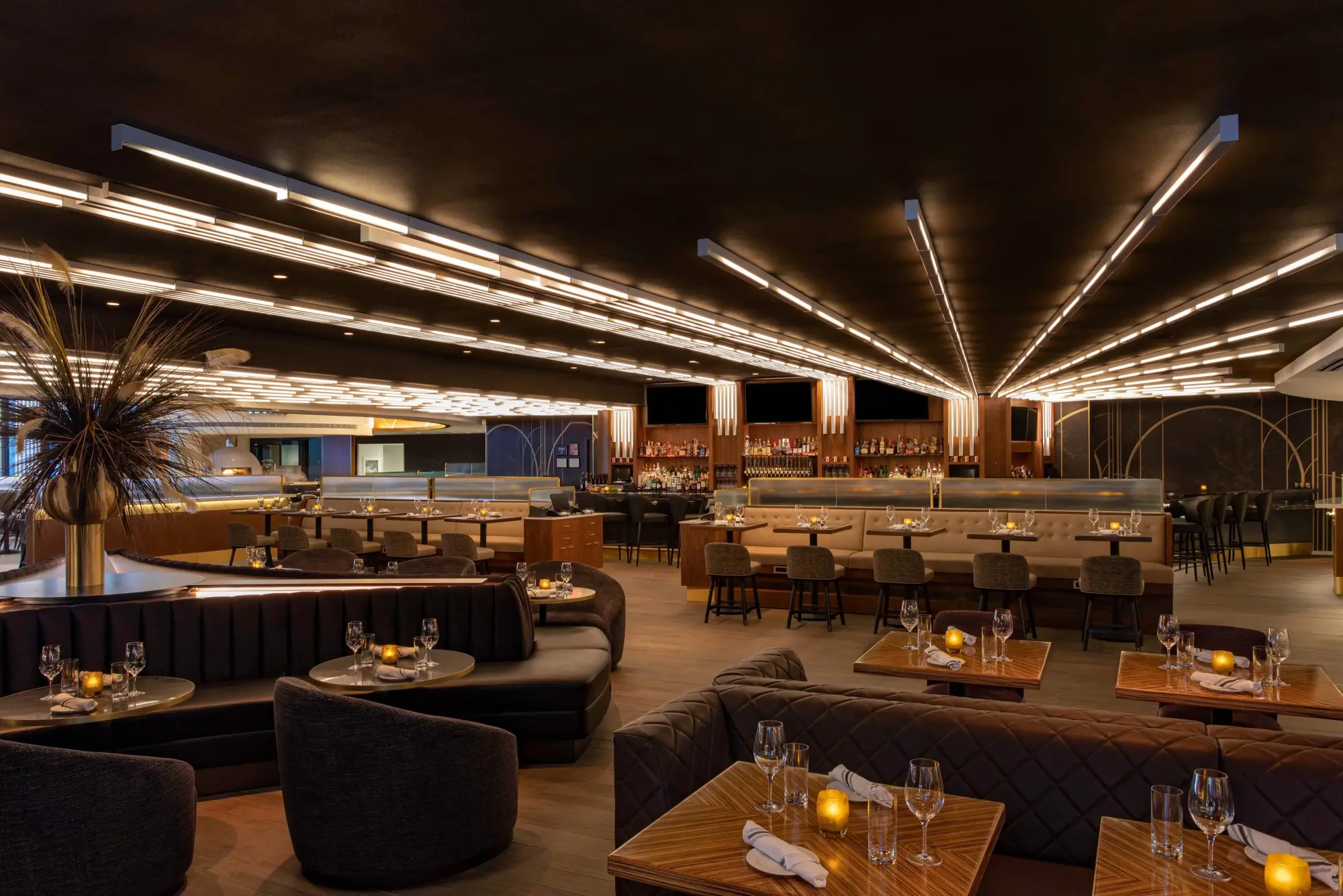 Moody lighting, classy decor and furnishings set the theme for an upscale casual restaurant at New York Mariott Marquis