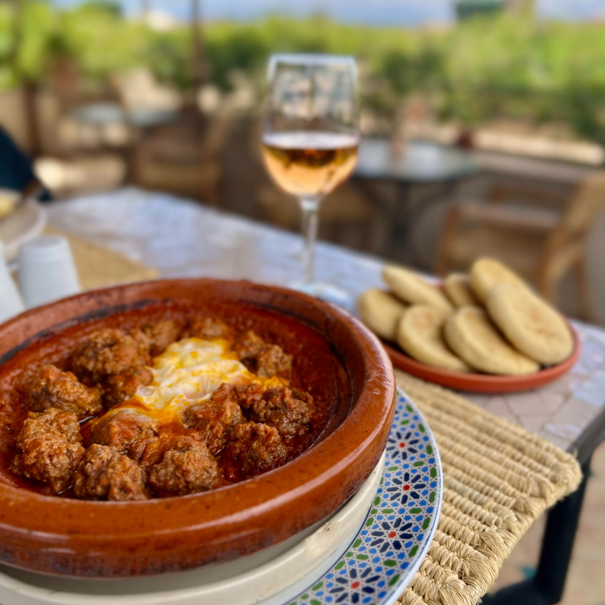 Moroccan food with wine on a table.