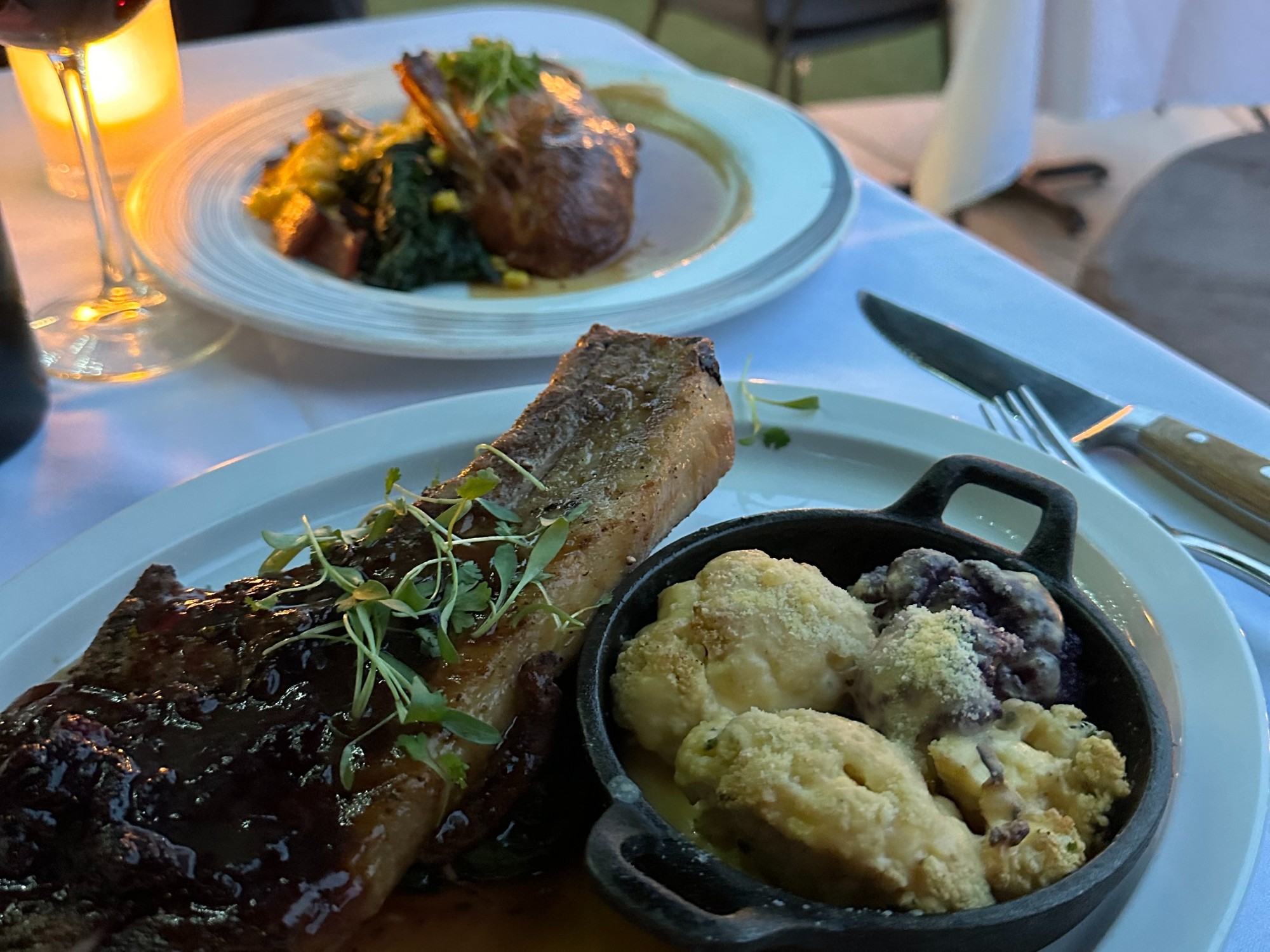 Food on white plates in a restaurant.