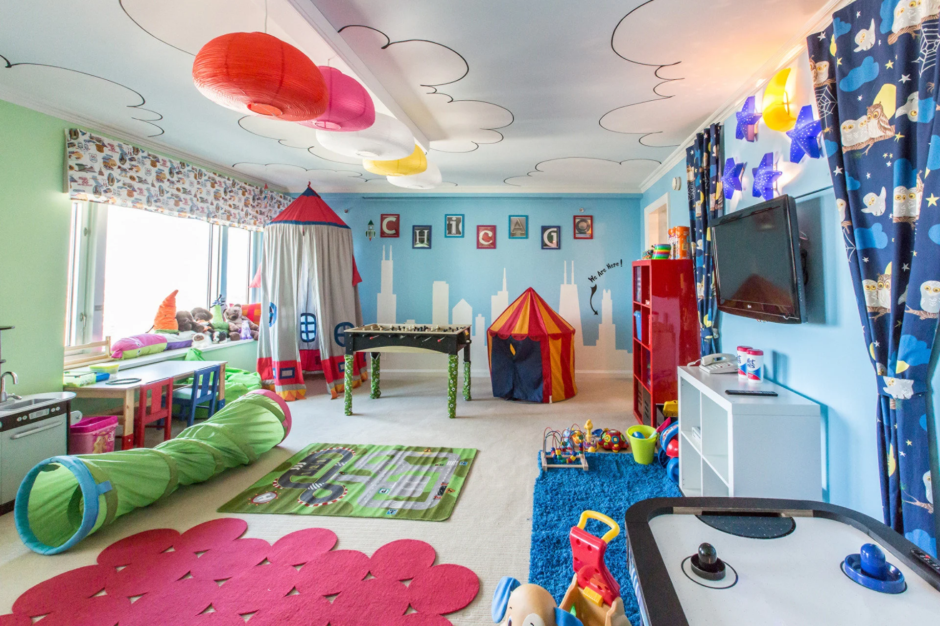 Child-friendly decor, toys and games fill a large room