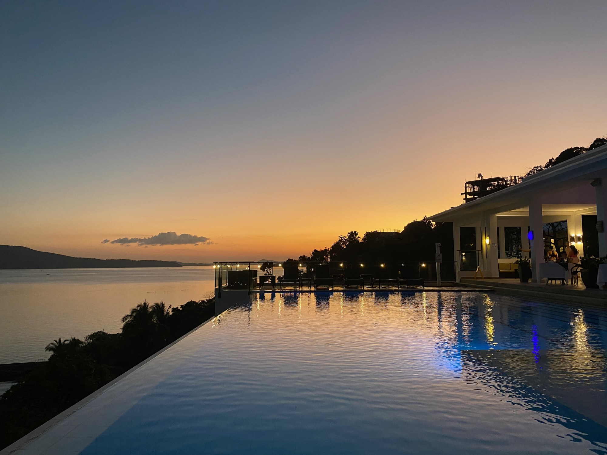 Sunset over an infinity pool.