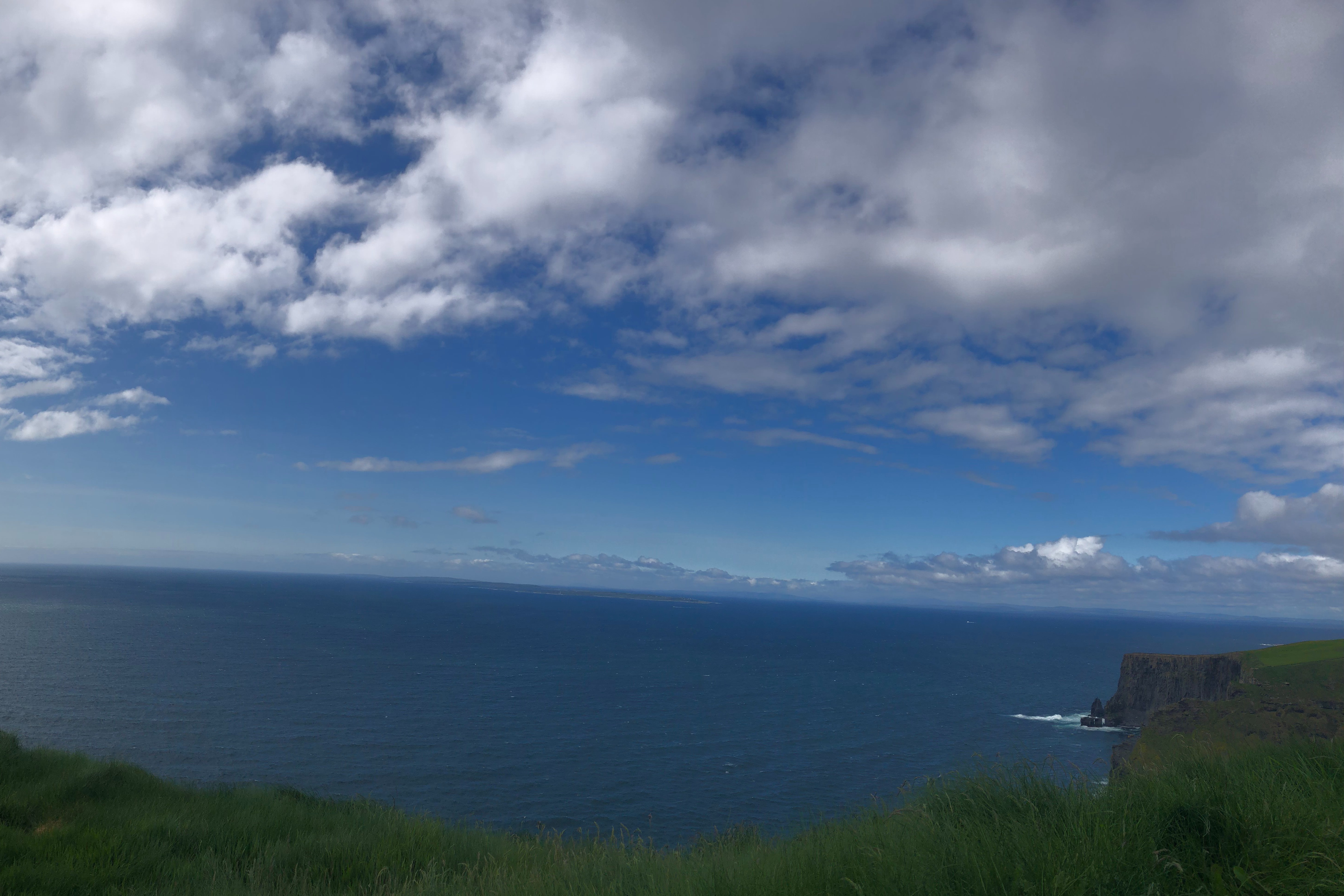 Grassy cliffs next to the water