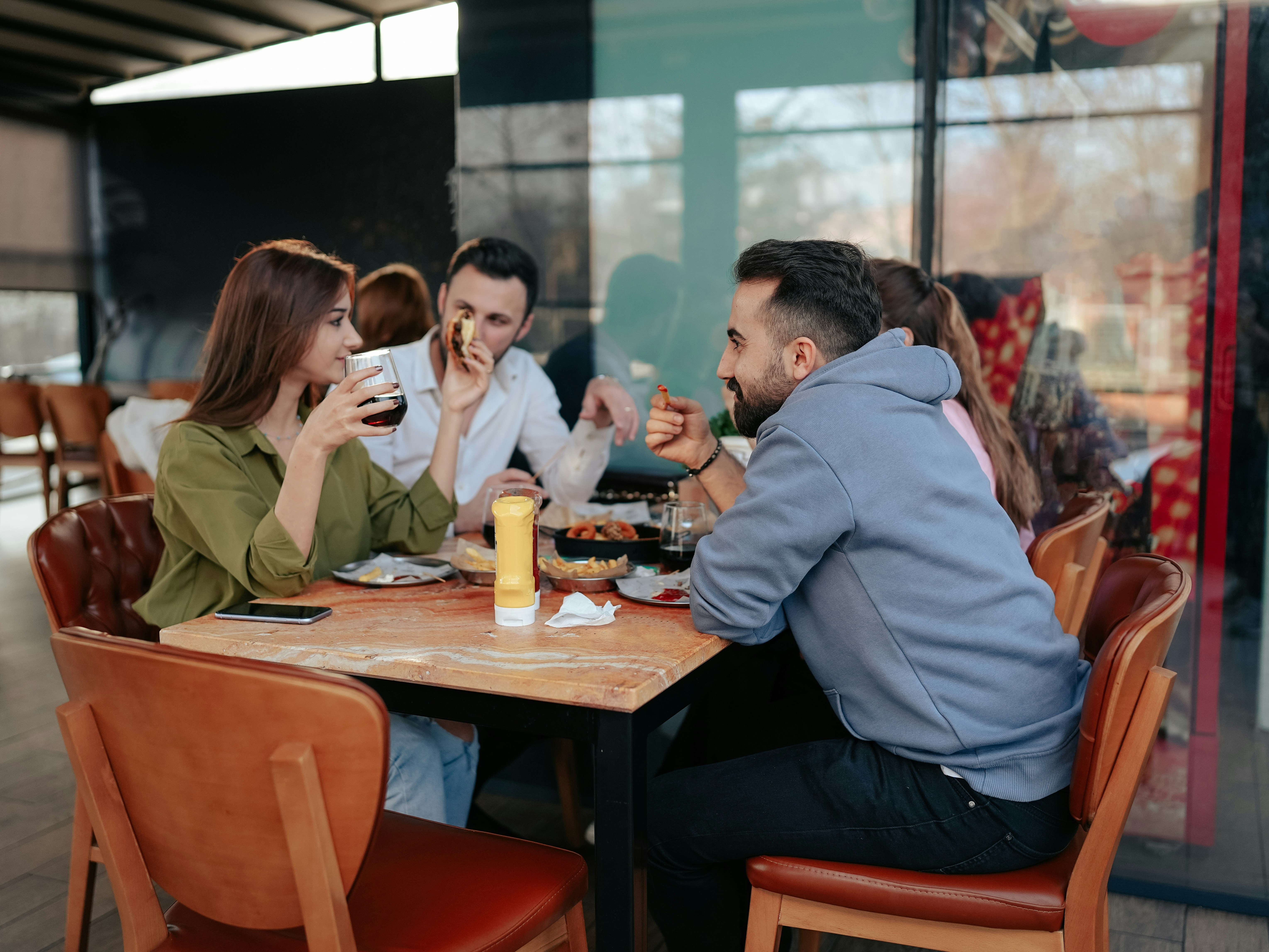 A cozy dining setup with four people enjoying a meal together.