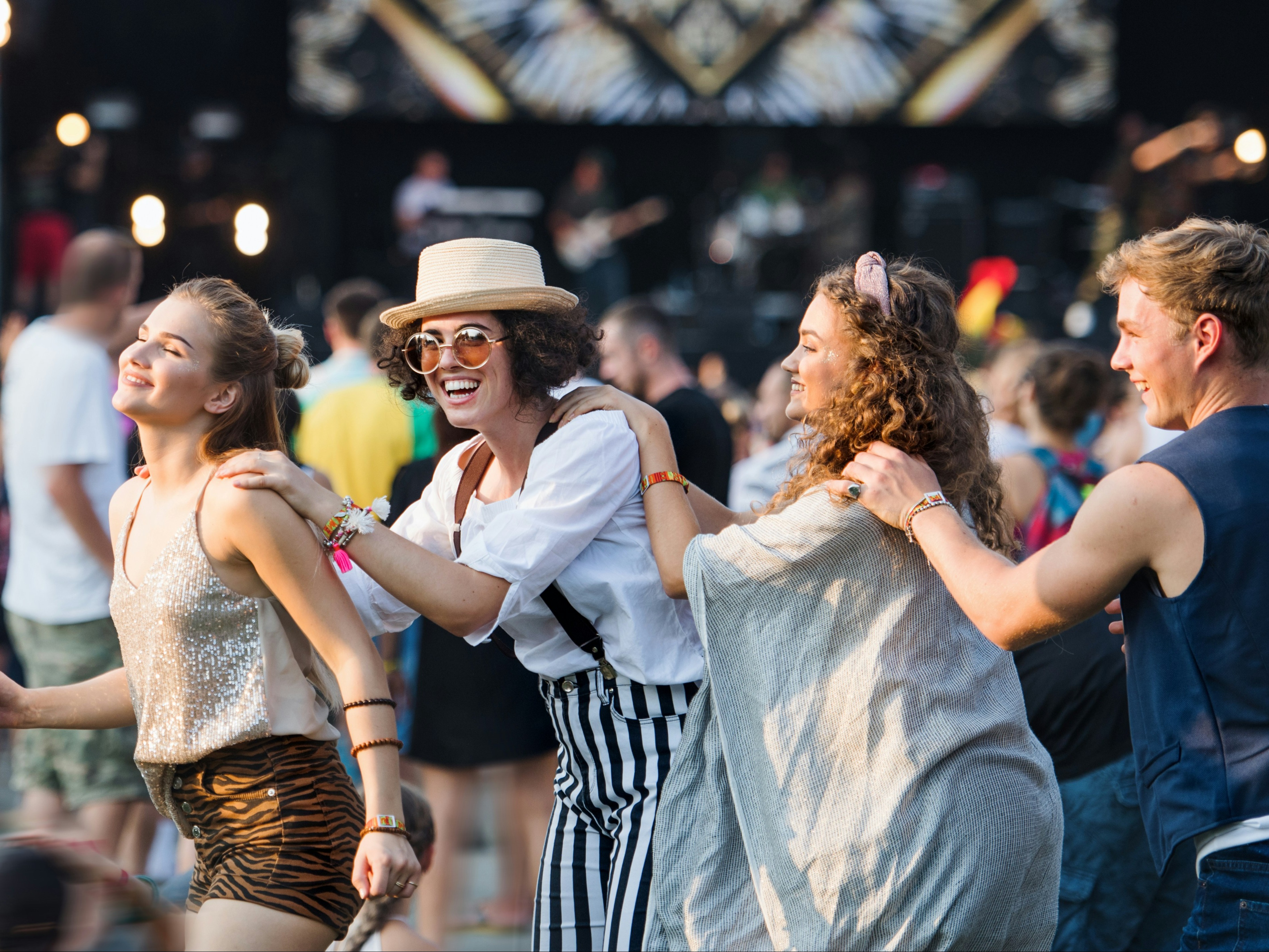 An outdoor music event with people enjoying the atmosphere.