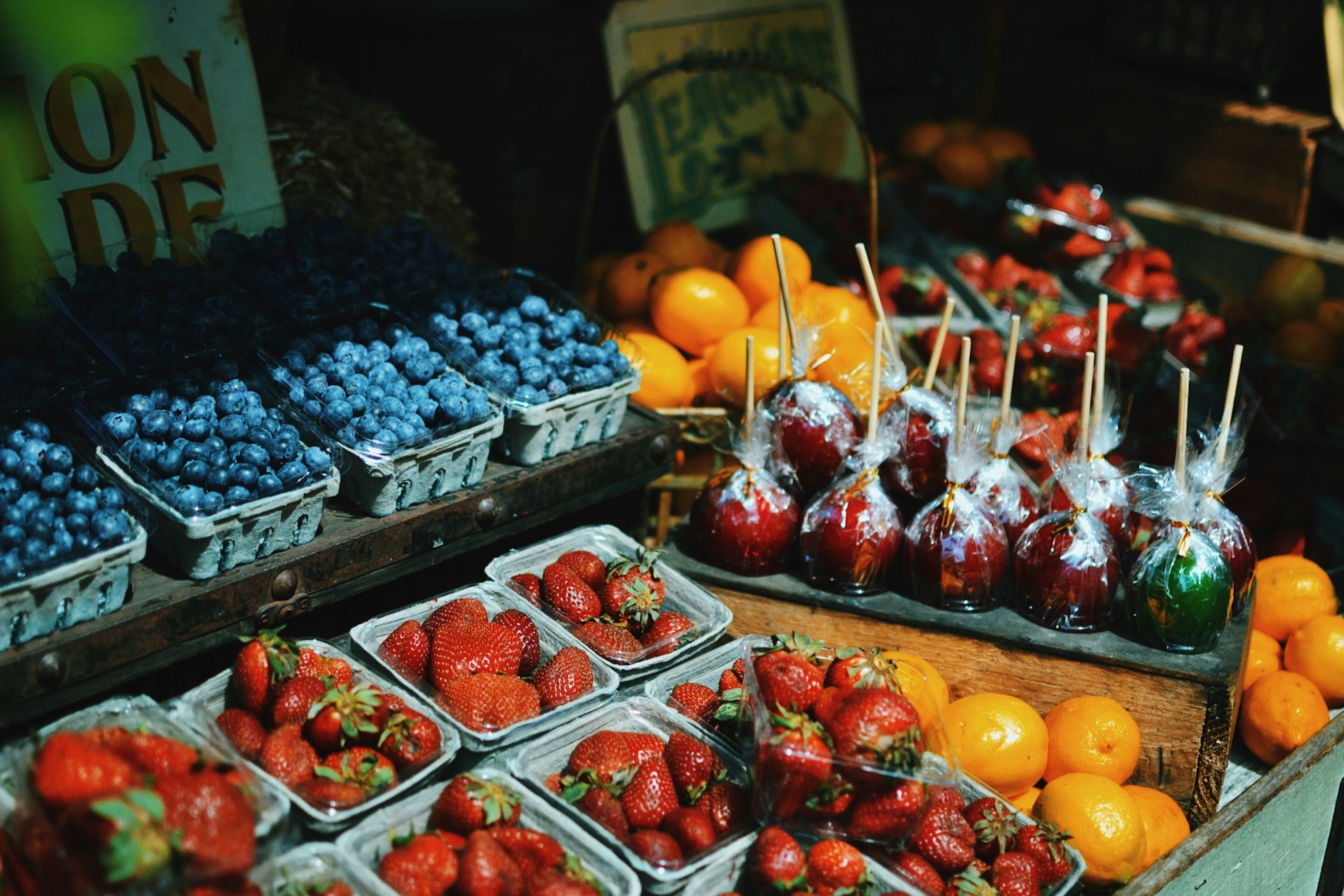 Stall of blueberries and strawberries.