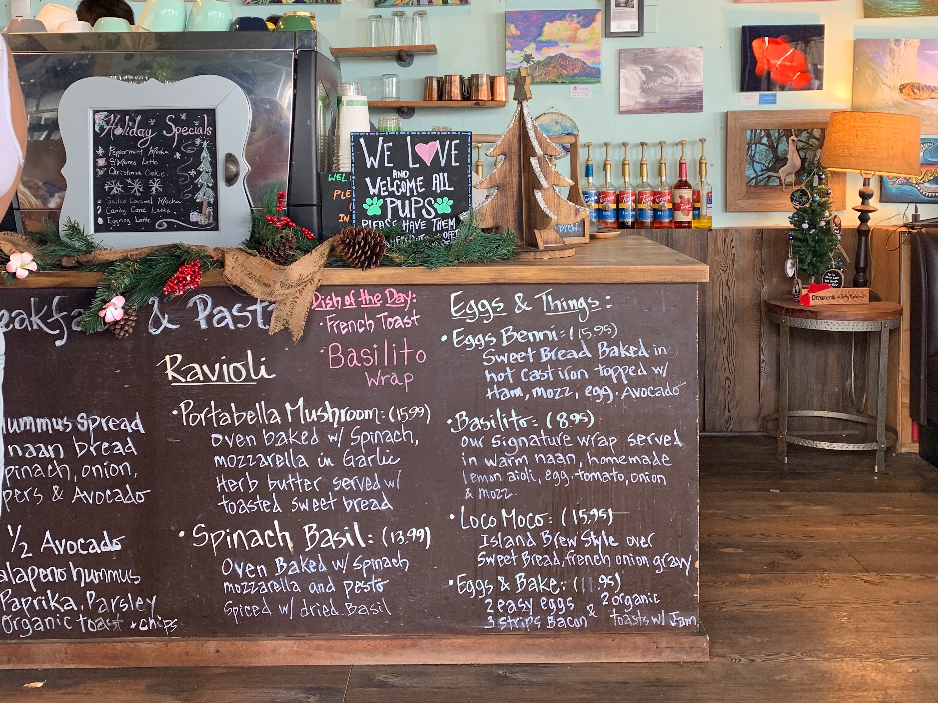 A cozy cafe interior with chalkboard menus and a welcoming atmosphere.