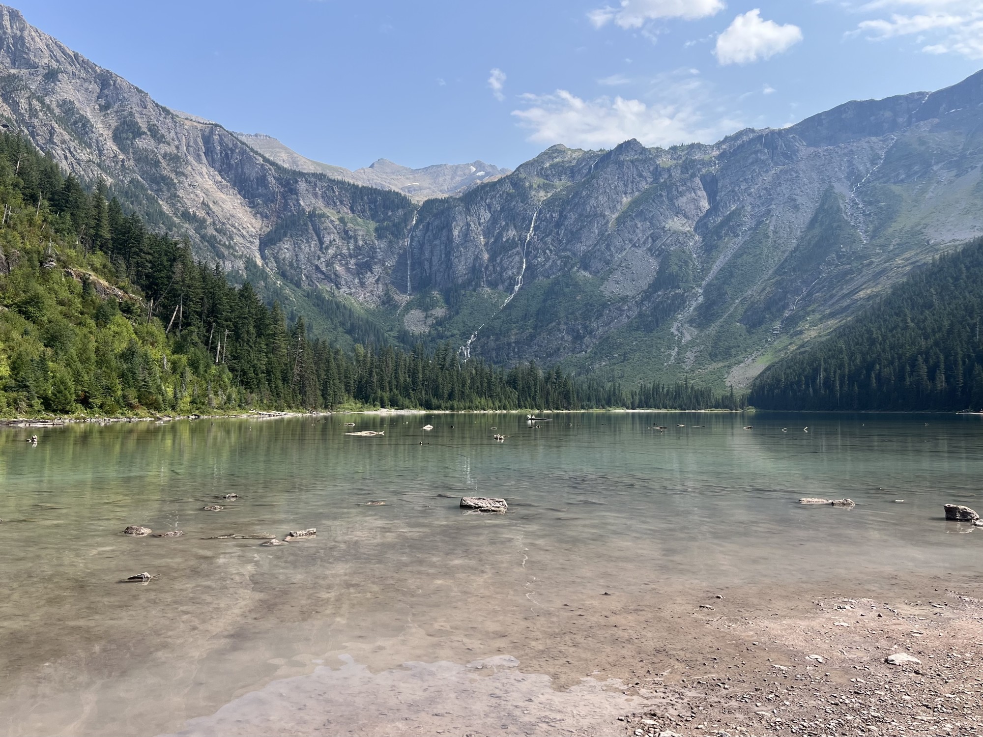 Clear lake surrounded by mountains.