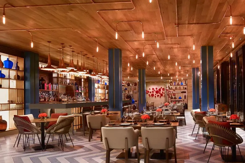 Unique decor fills a high-end restaurant at Montage Los Cabos, with a mix of industrial and Baja influences but an upscale vibe