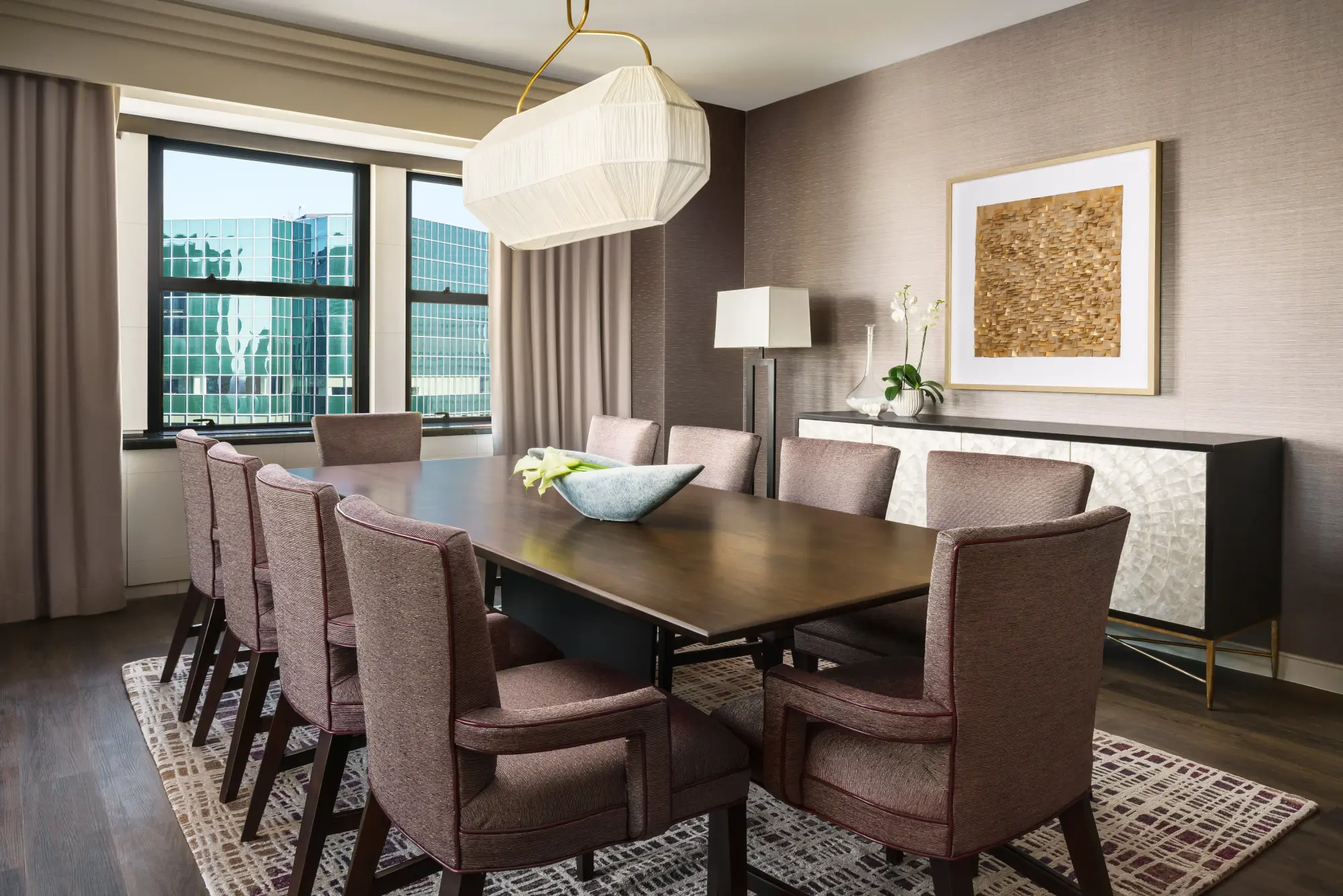 Private dining room table with chic decor and a skyline view