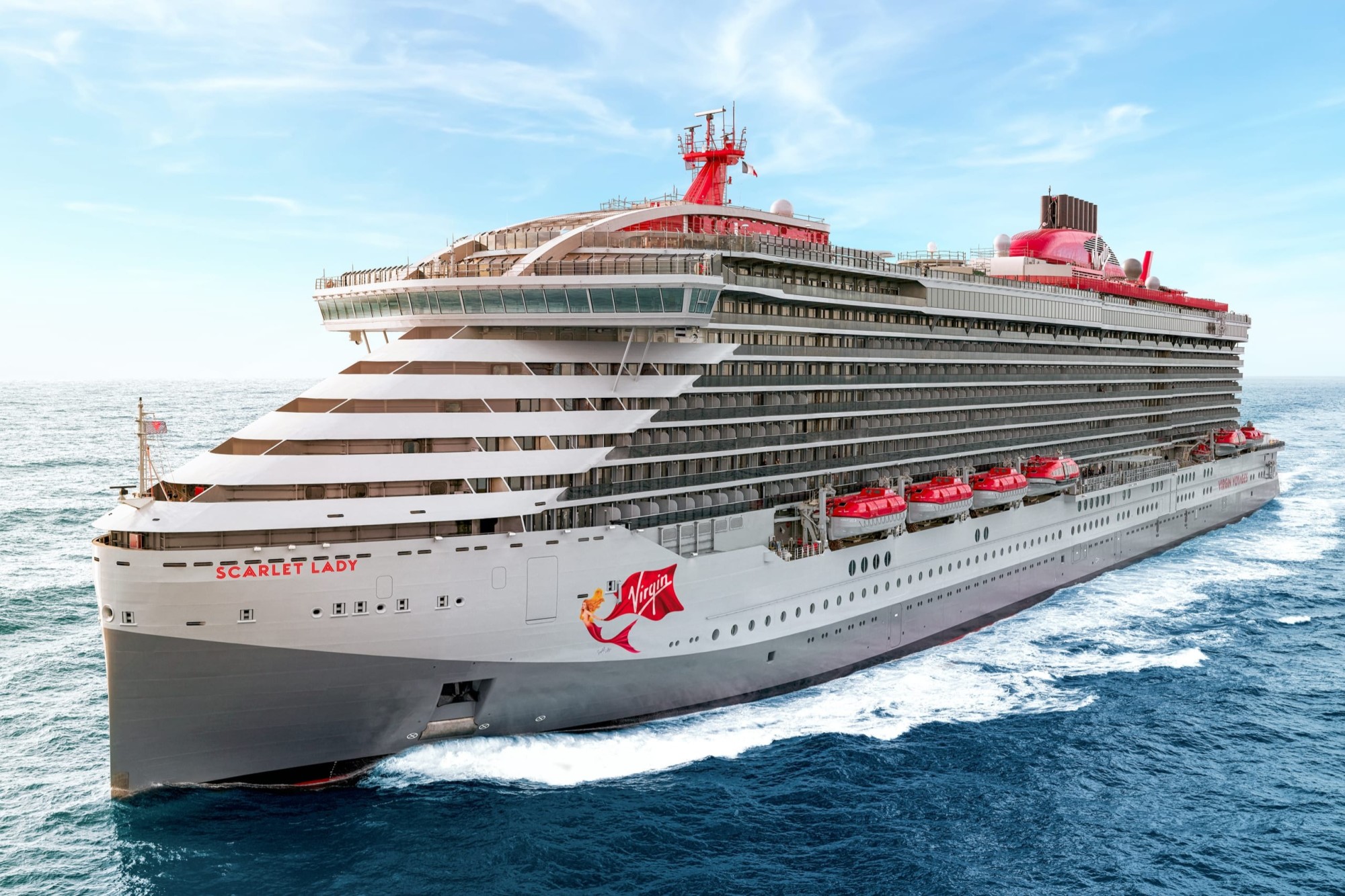 The Scarlet Lady cruise ship sailing on mostly calm open seas
