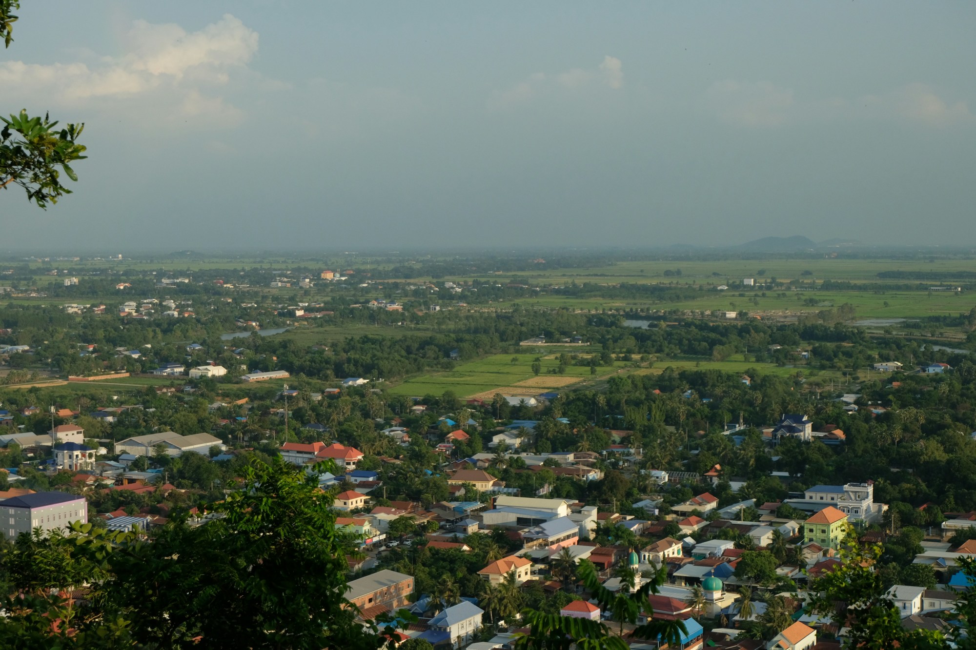 A bird's eye view of a Cambodian village on a clear day.