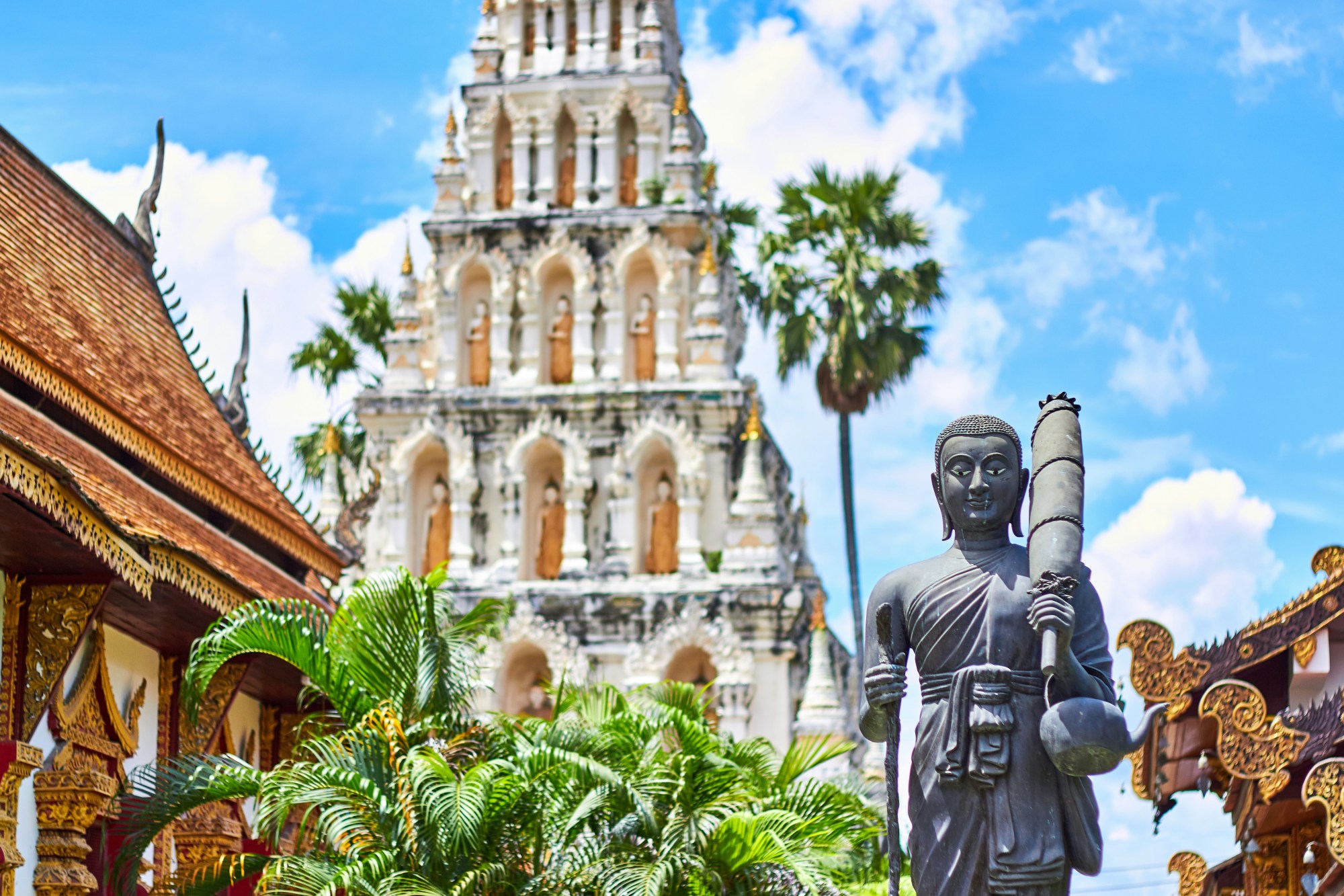 An historic temple structure stands tall against a blue sky.