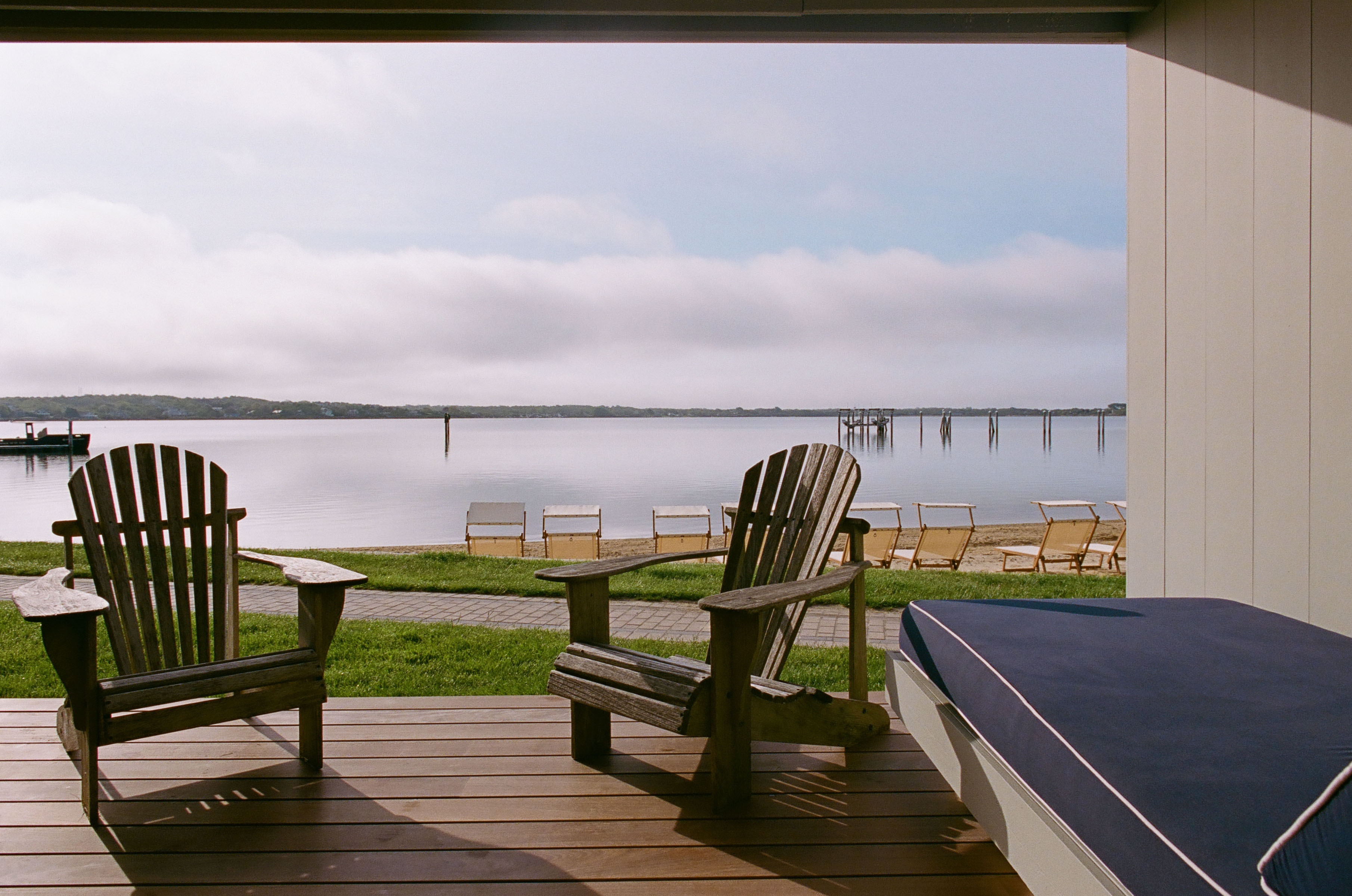 Spacious and chicly decorated room with plush bedding, plenty of seating and storage, plus pleasant views of the grounds at Montauk Yacht Club