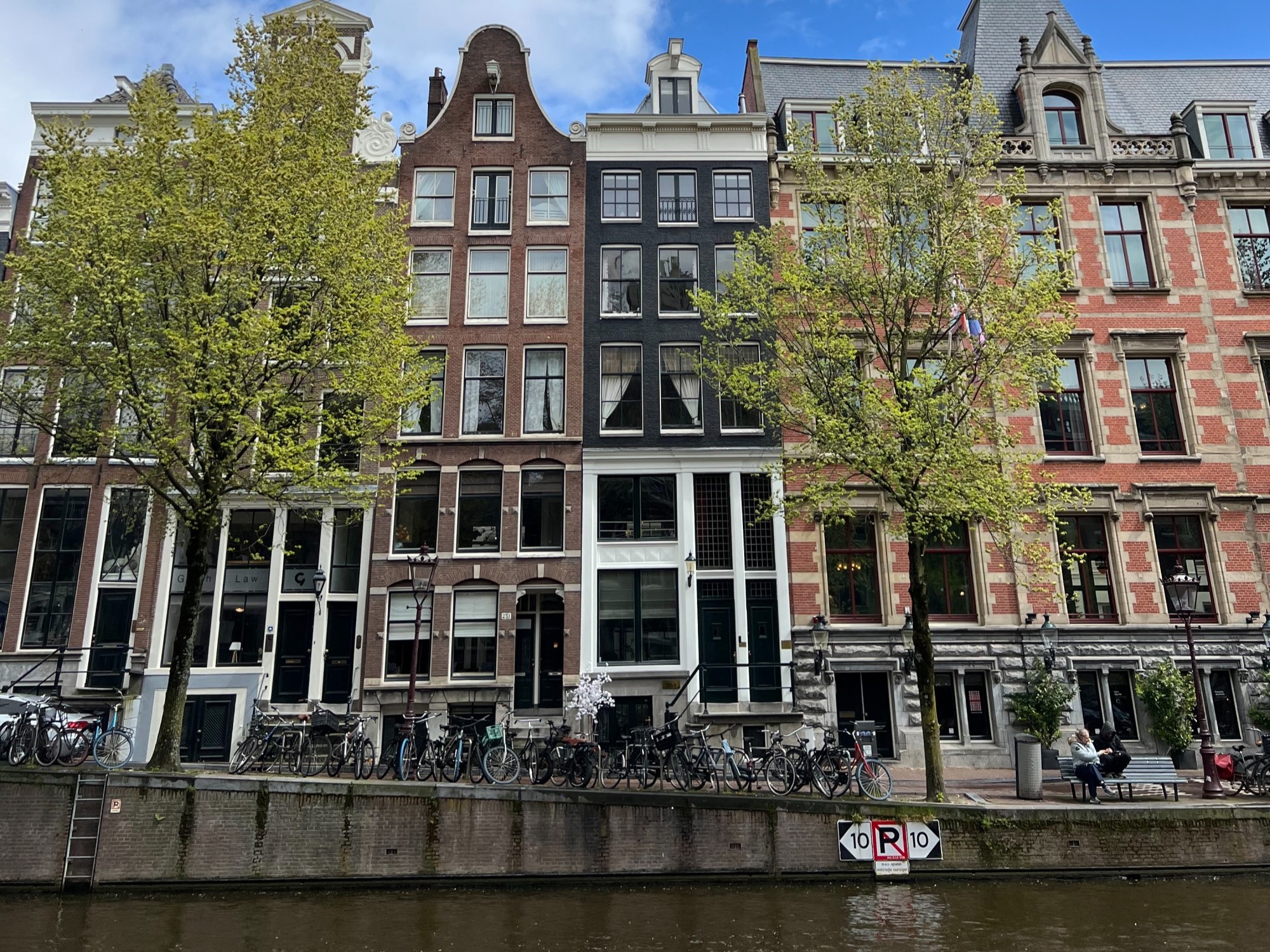 City canal with buildings behind it.