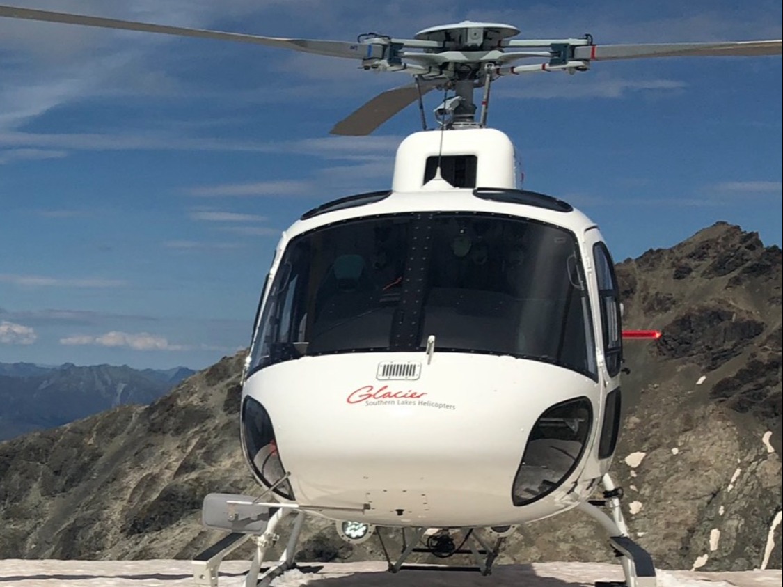 A view of a helicopter during the day.