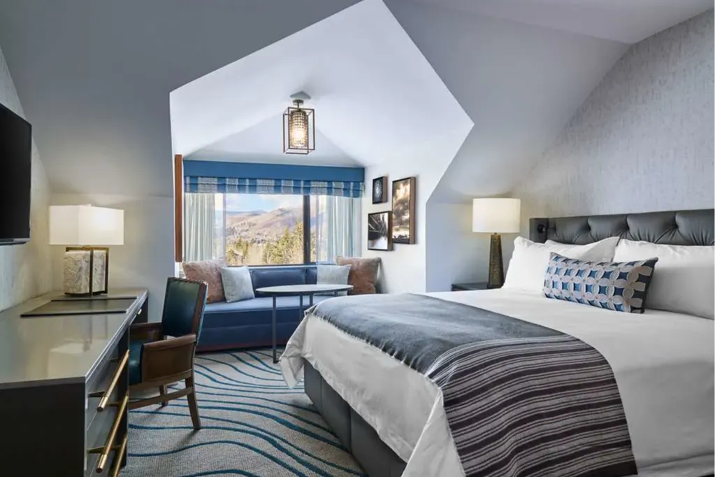 Spacious room with a king bed, simple but stylish furnishings and a great view of the surrounding forest and slopes