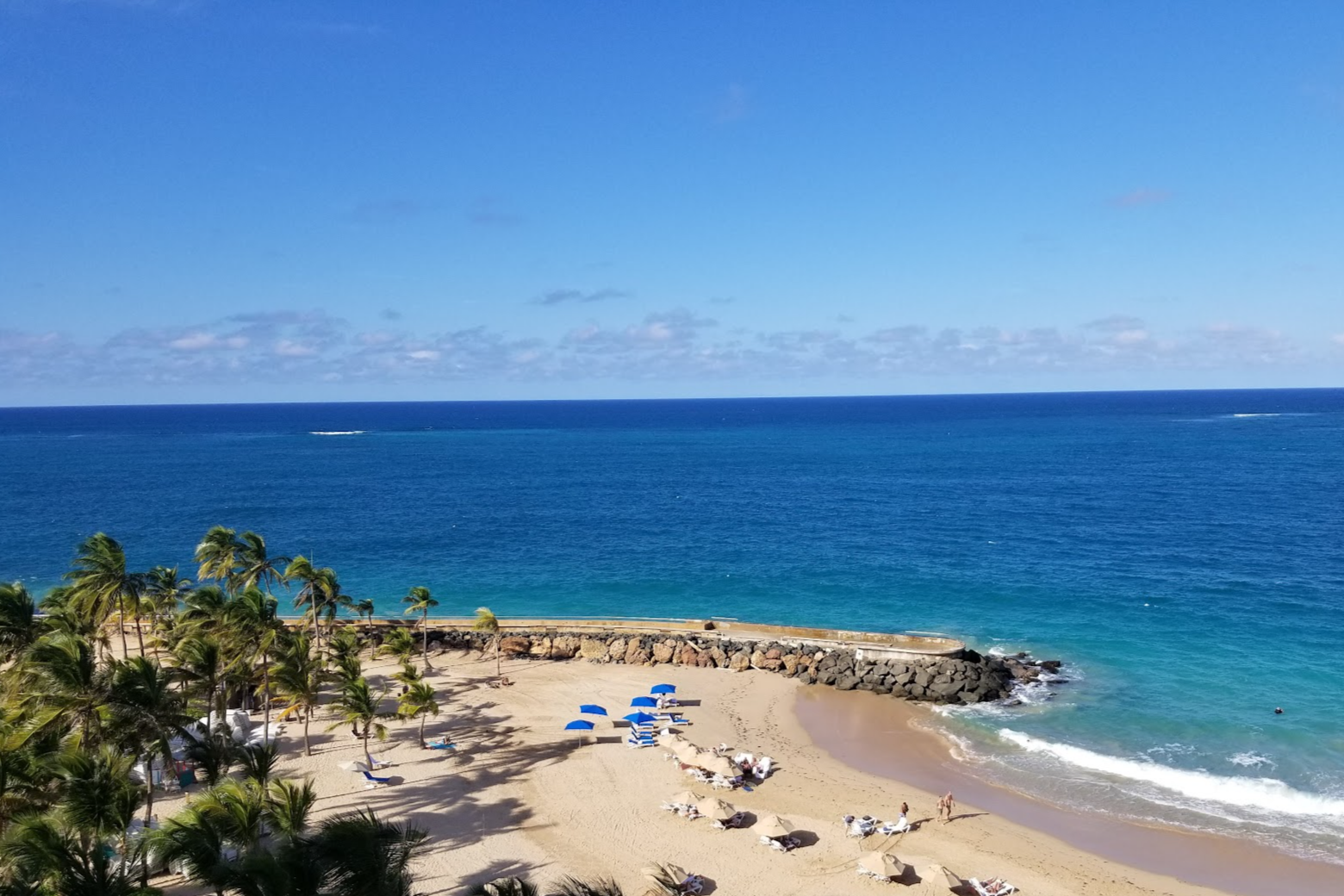 Condado Beach is known for its golden sands and waves lap the shore on a sunny day.