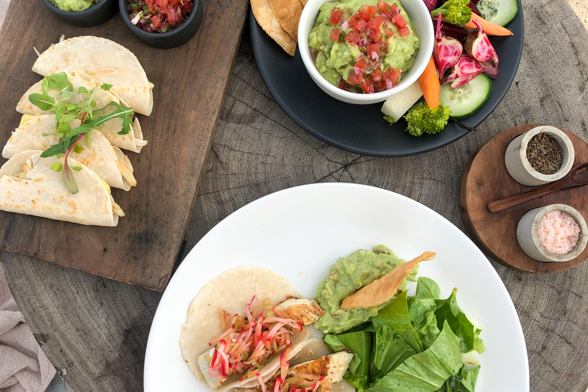 Traditional food served on plates on a wooden table