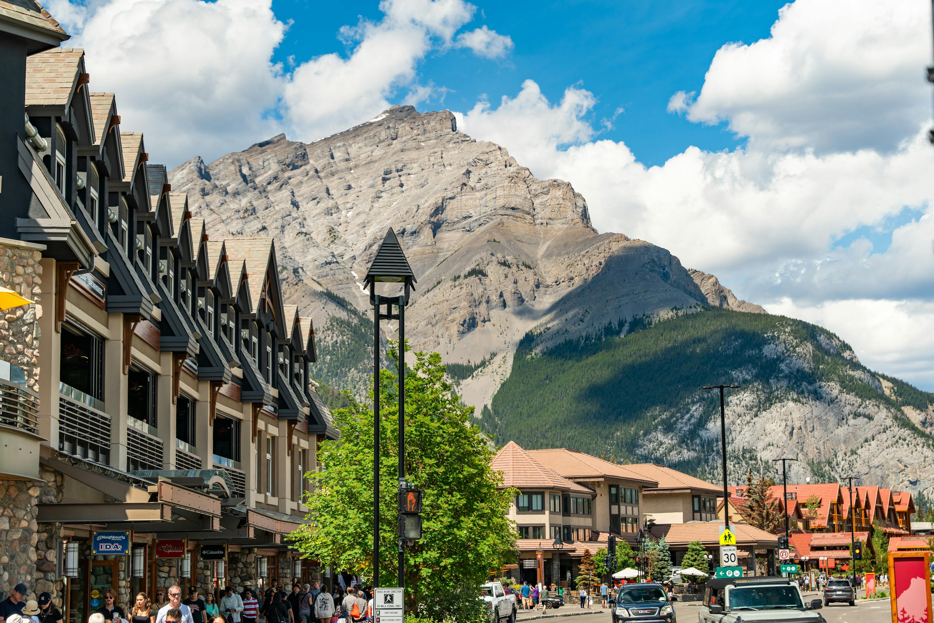 Town of Banff with mountain in the cascading toward the sky on a sunny day.