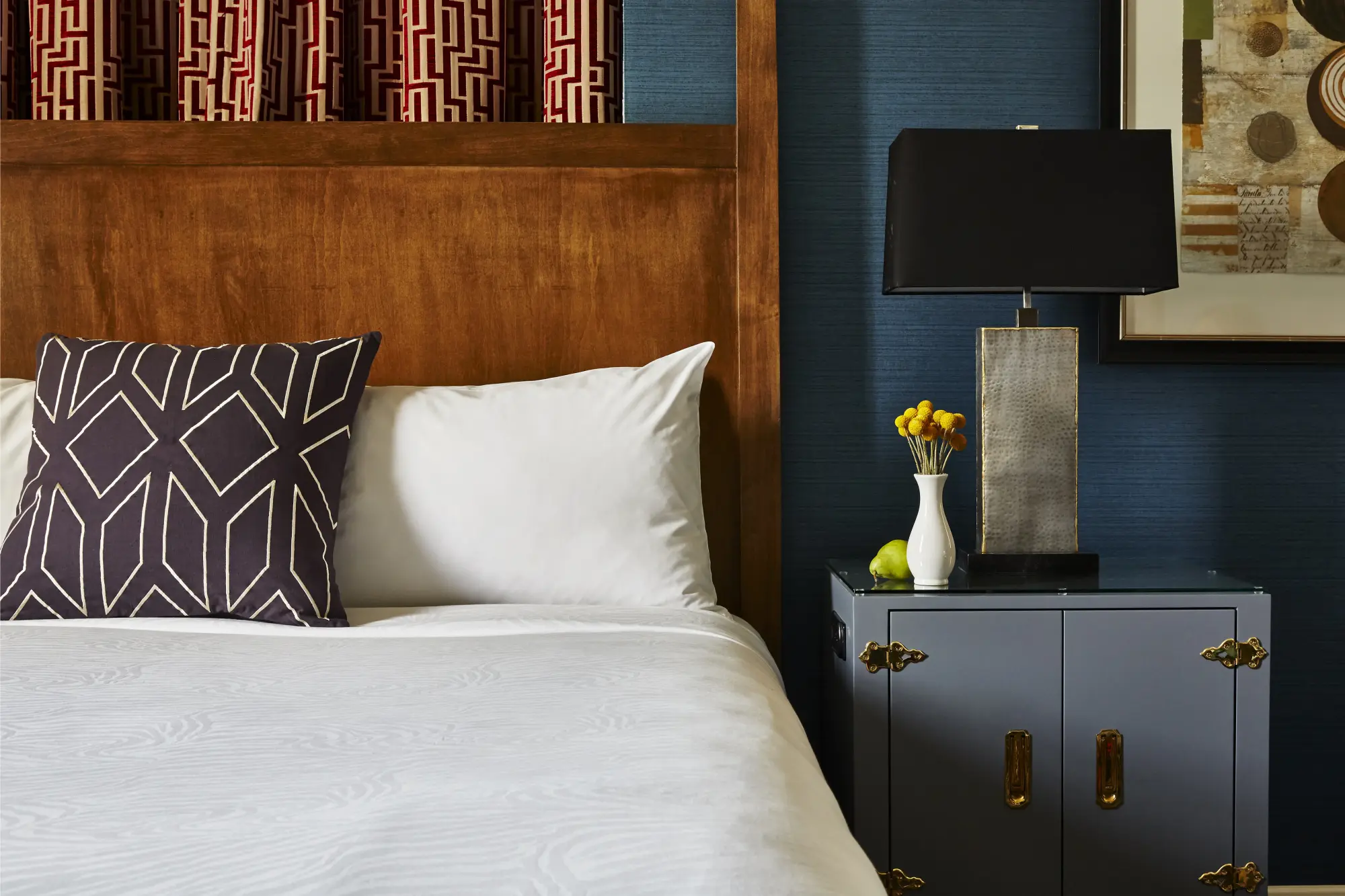 Chic, contemporary decor plus plush bedding in a luxe room at Kimpton Hotel Monaco