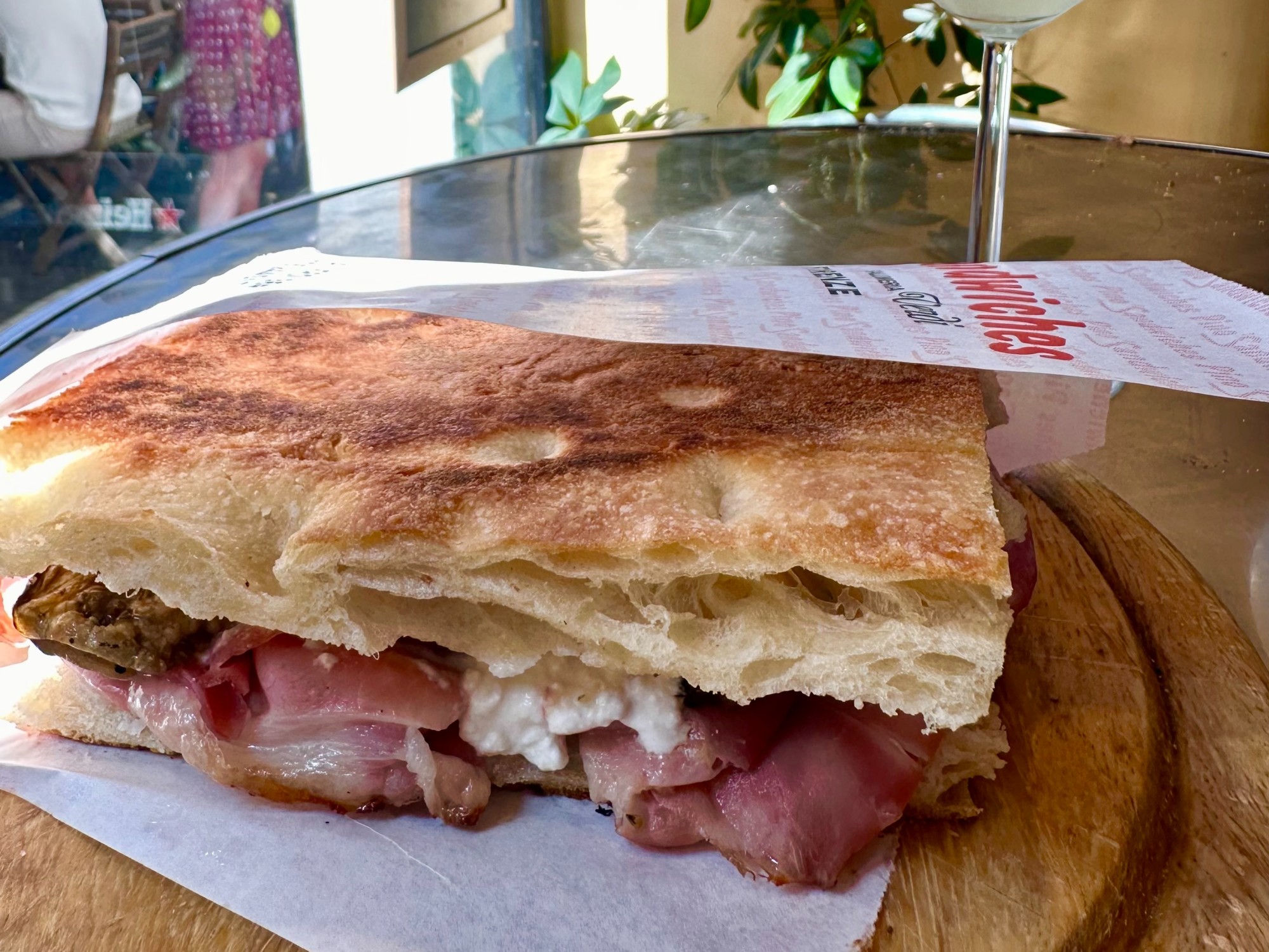 Sandwich on a brown plate.