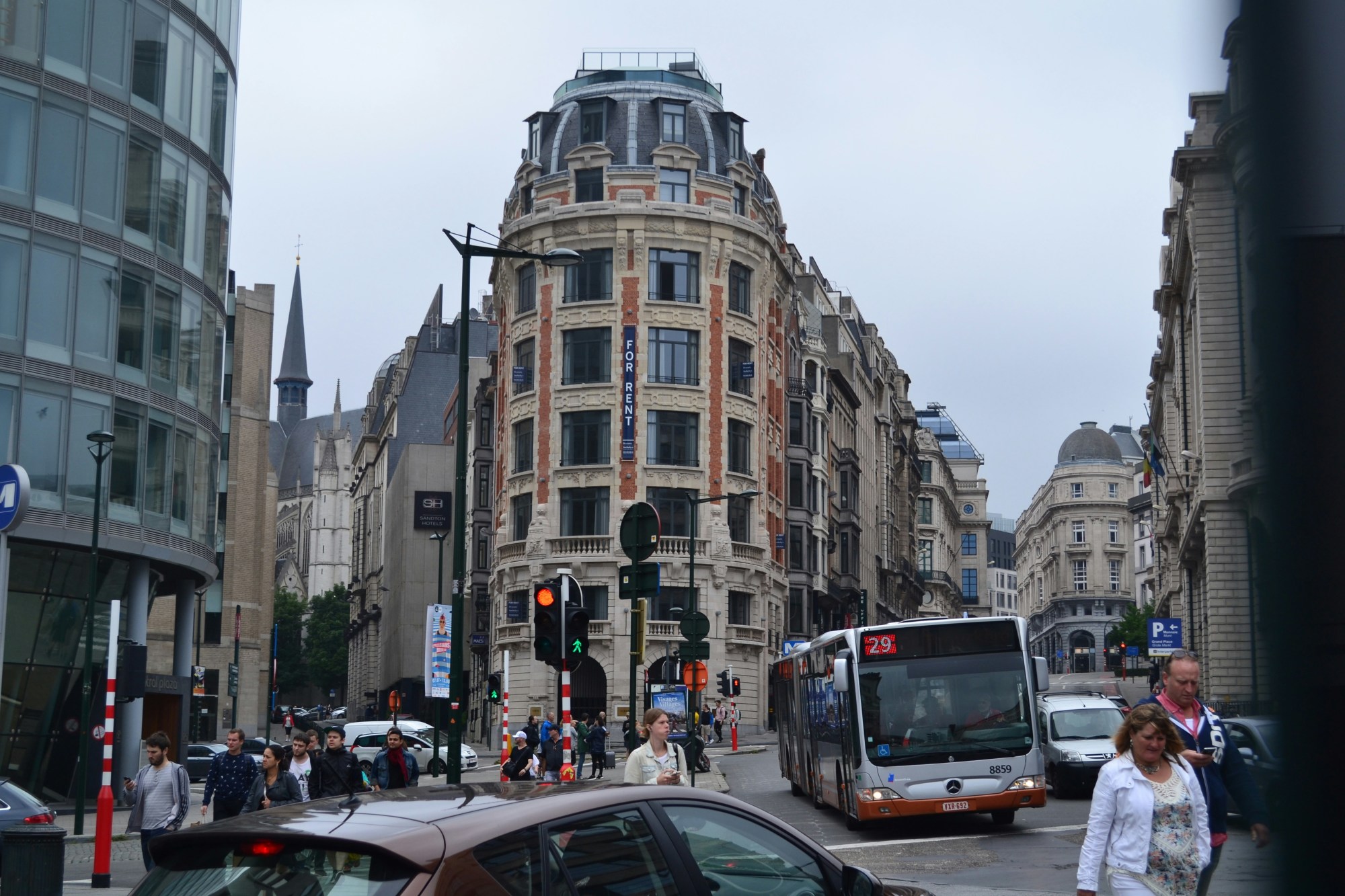 City with people, buildings and traffic.