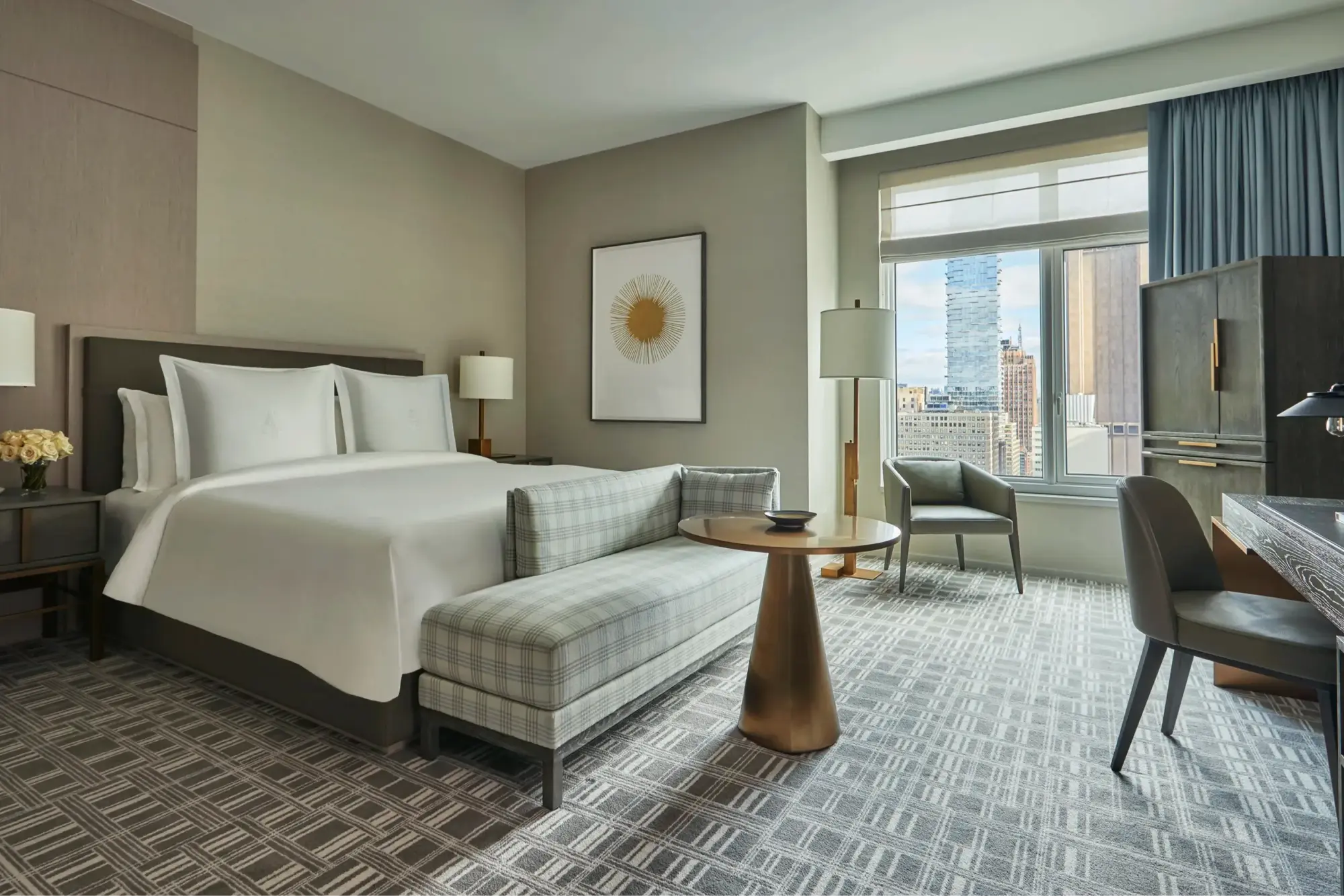 Sleek but simple decor in a spacious suite at Four Seasons Hotel New York Downtown, plus skyline views from the window