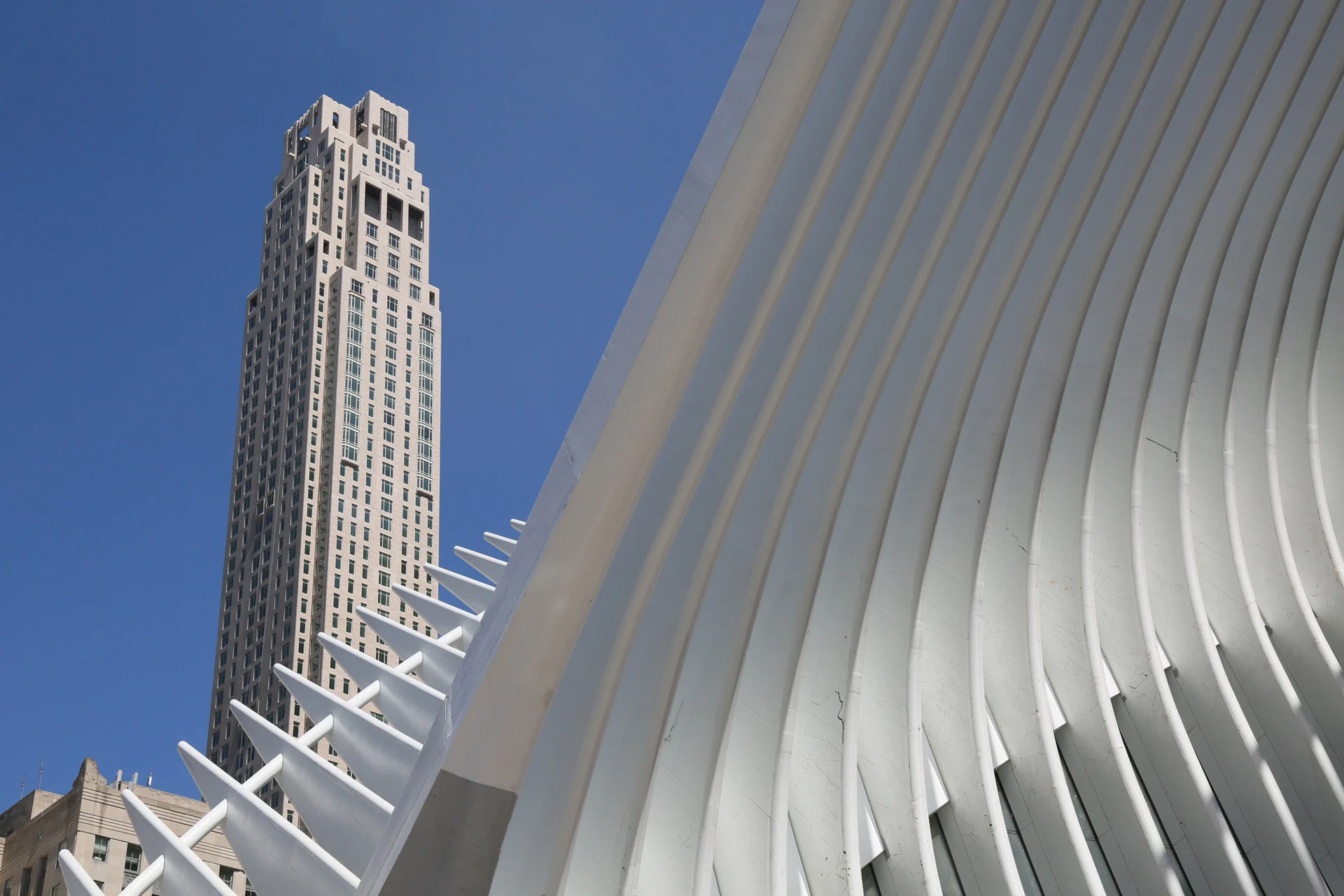View of Four Seasons Hotel New York from the ground with geometric architecture obscuring the base