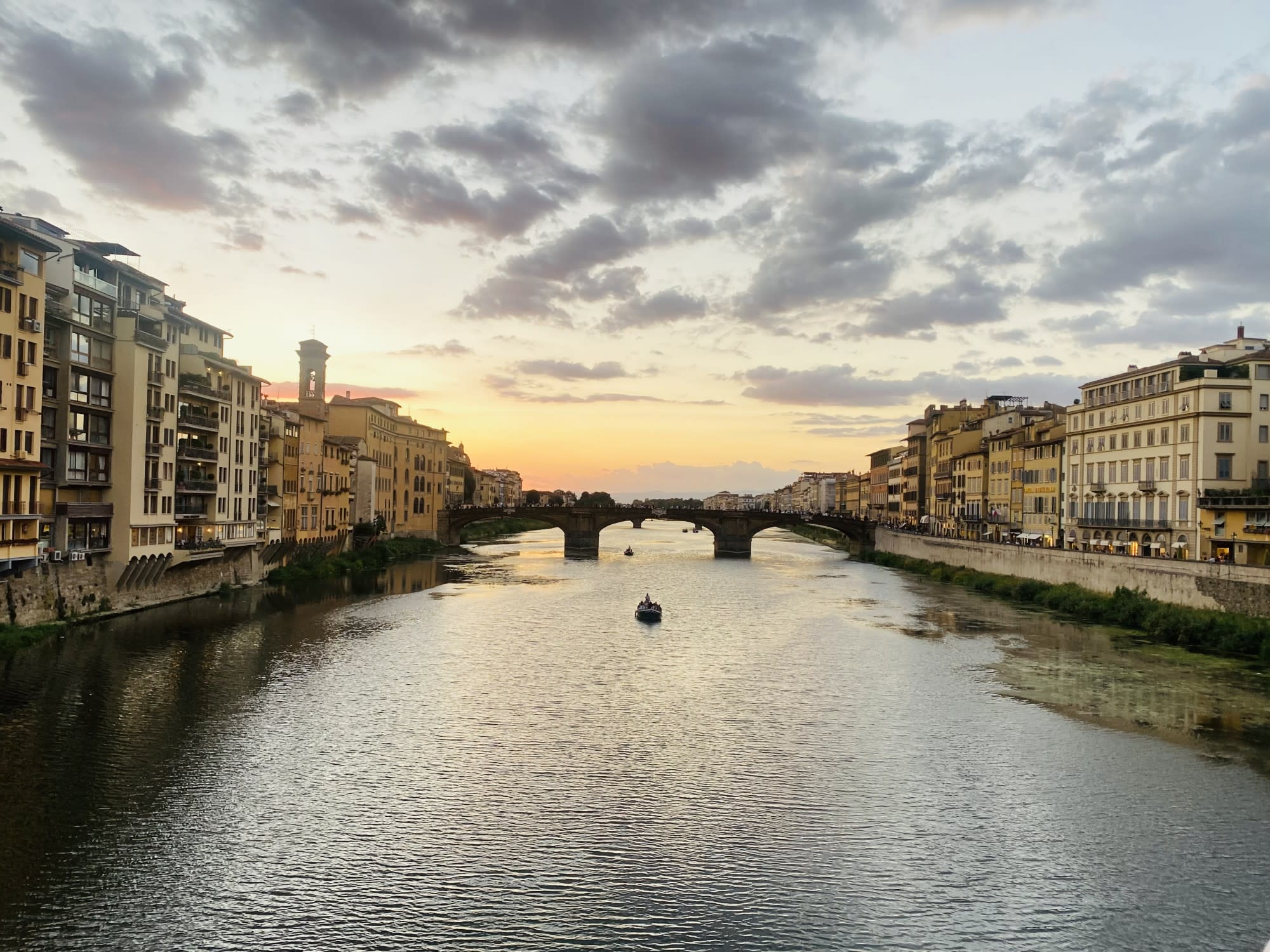 A view of a canal in Italy at dusk.