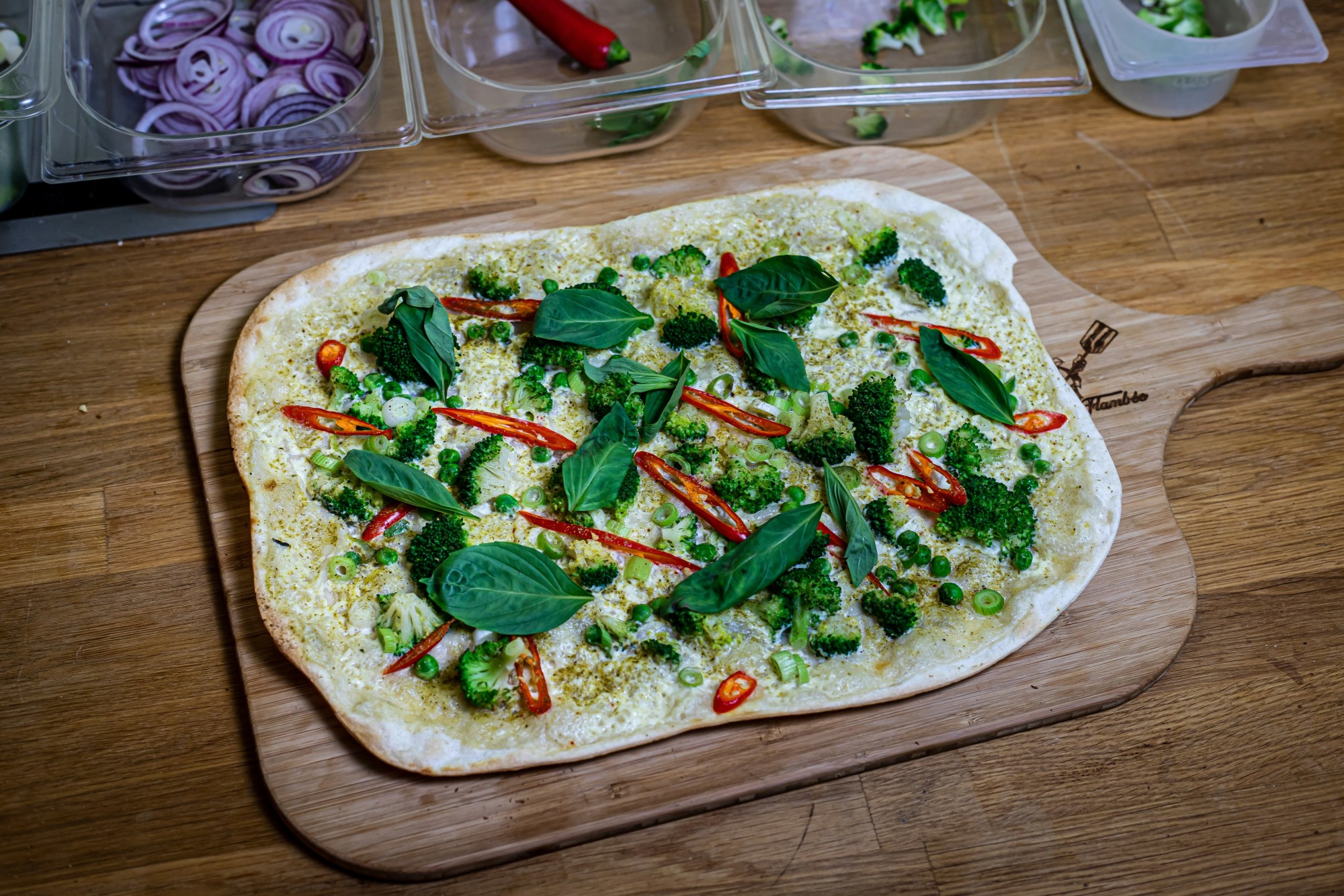 Pizza on a wooden tray.