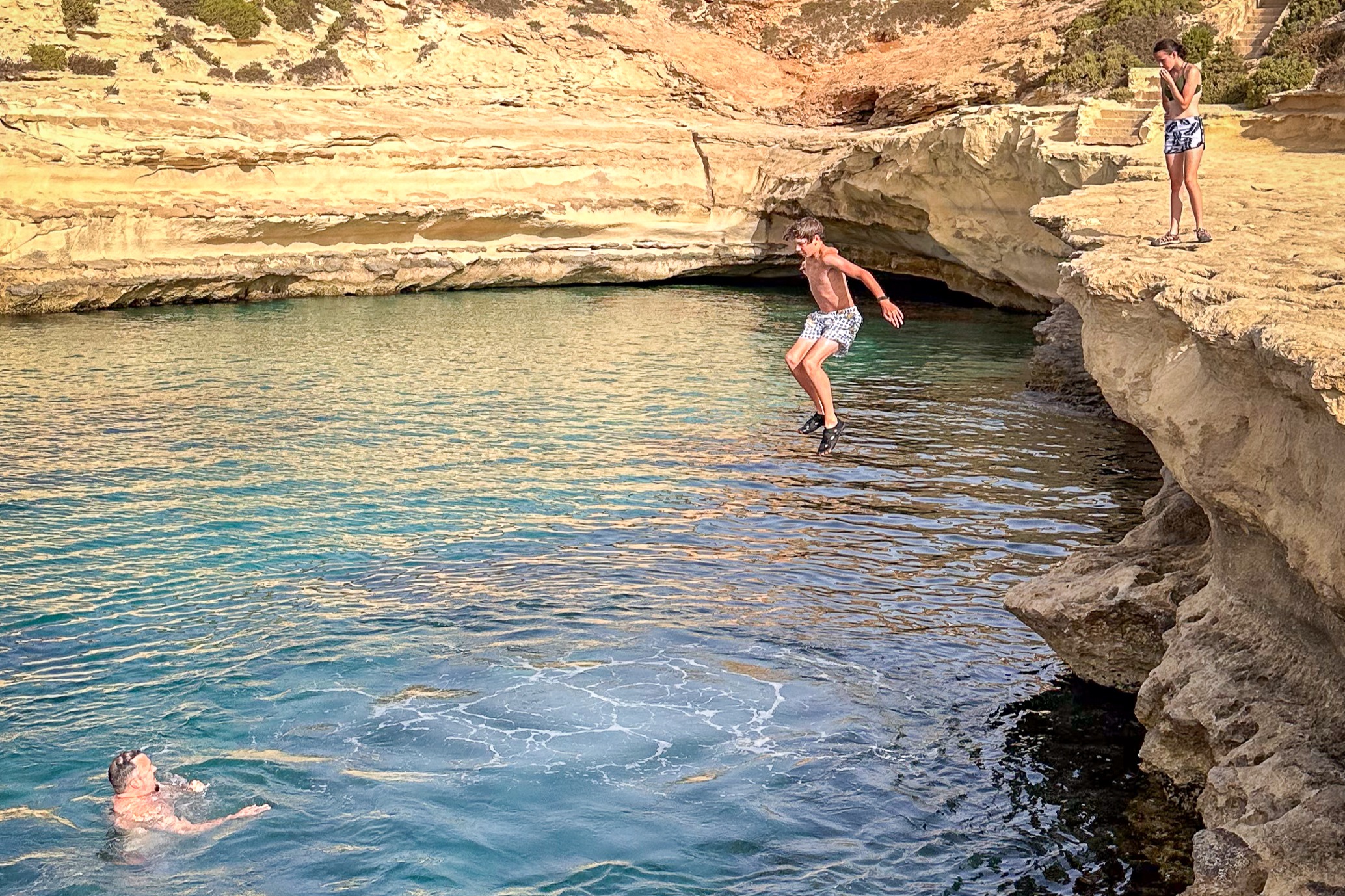 People swimming at the small island of Malta.