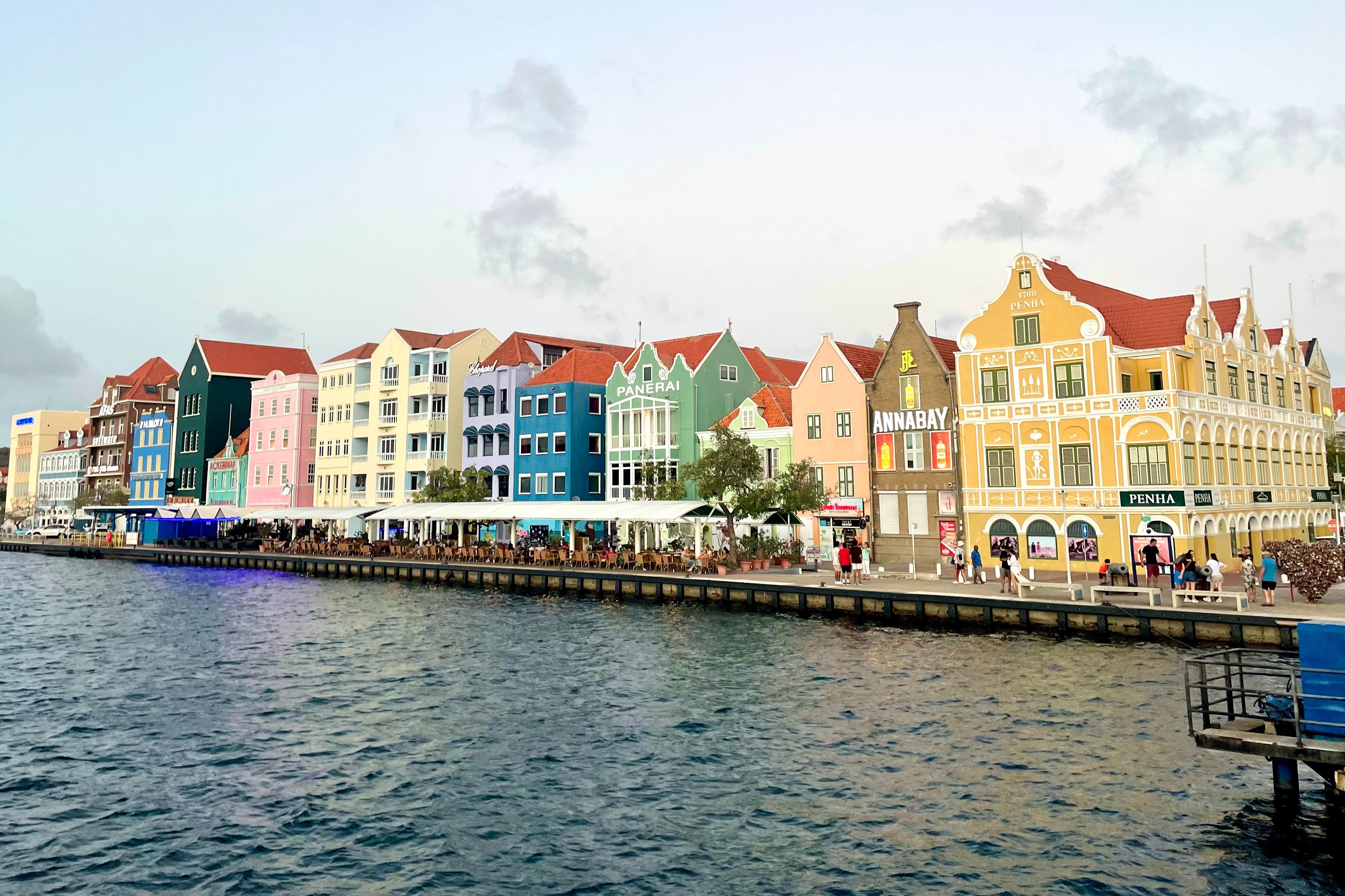 Colorful row homes along the edge of the harbor.