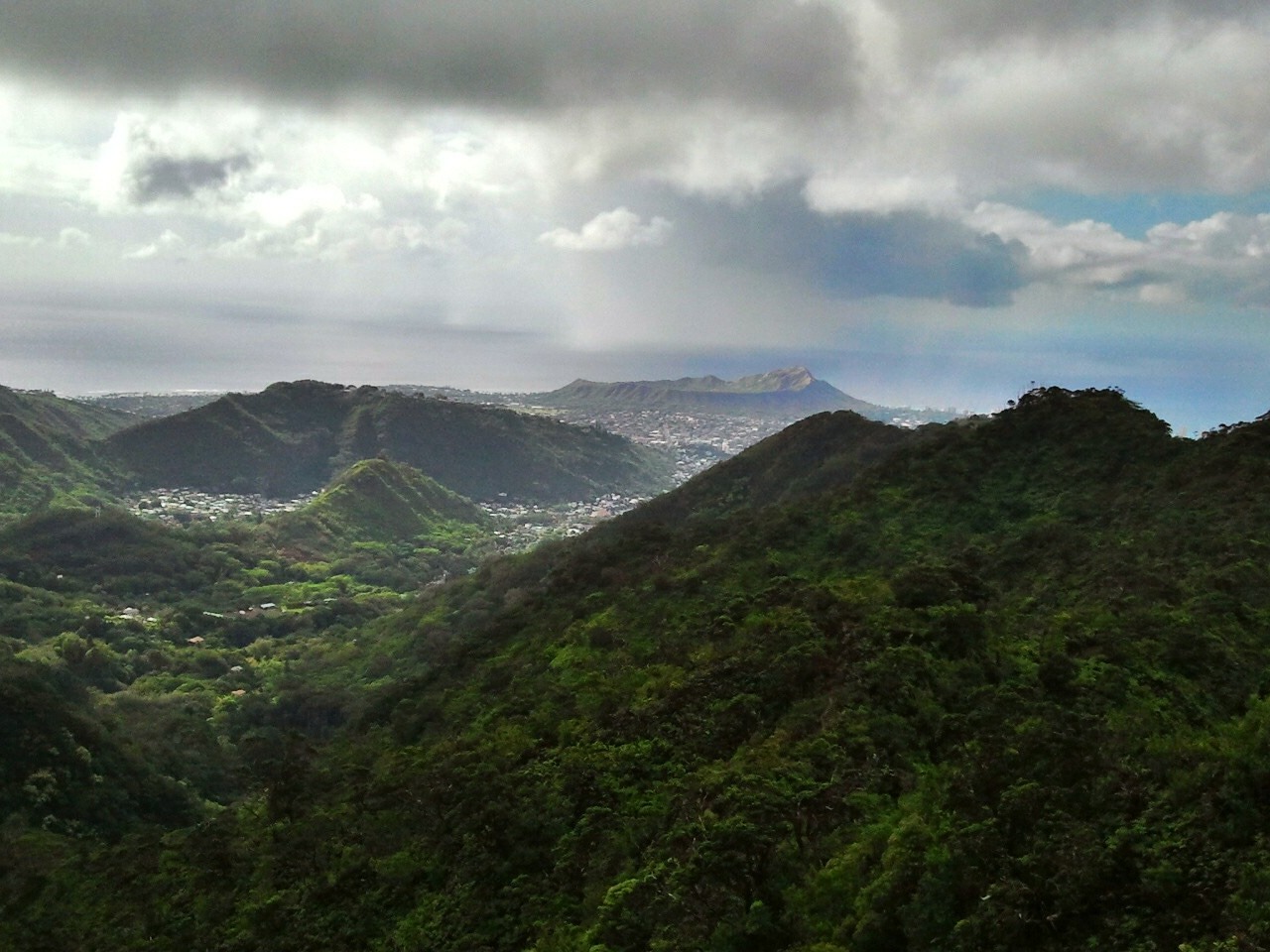 A landscape of green mountain ranges during the daytime