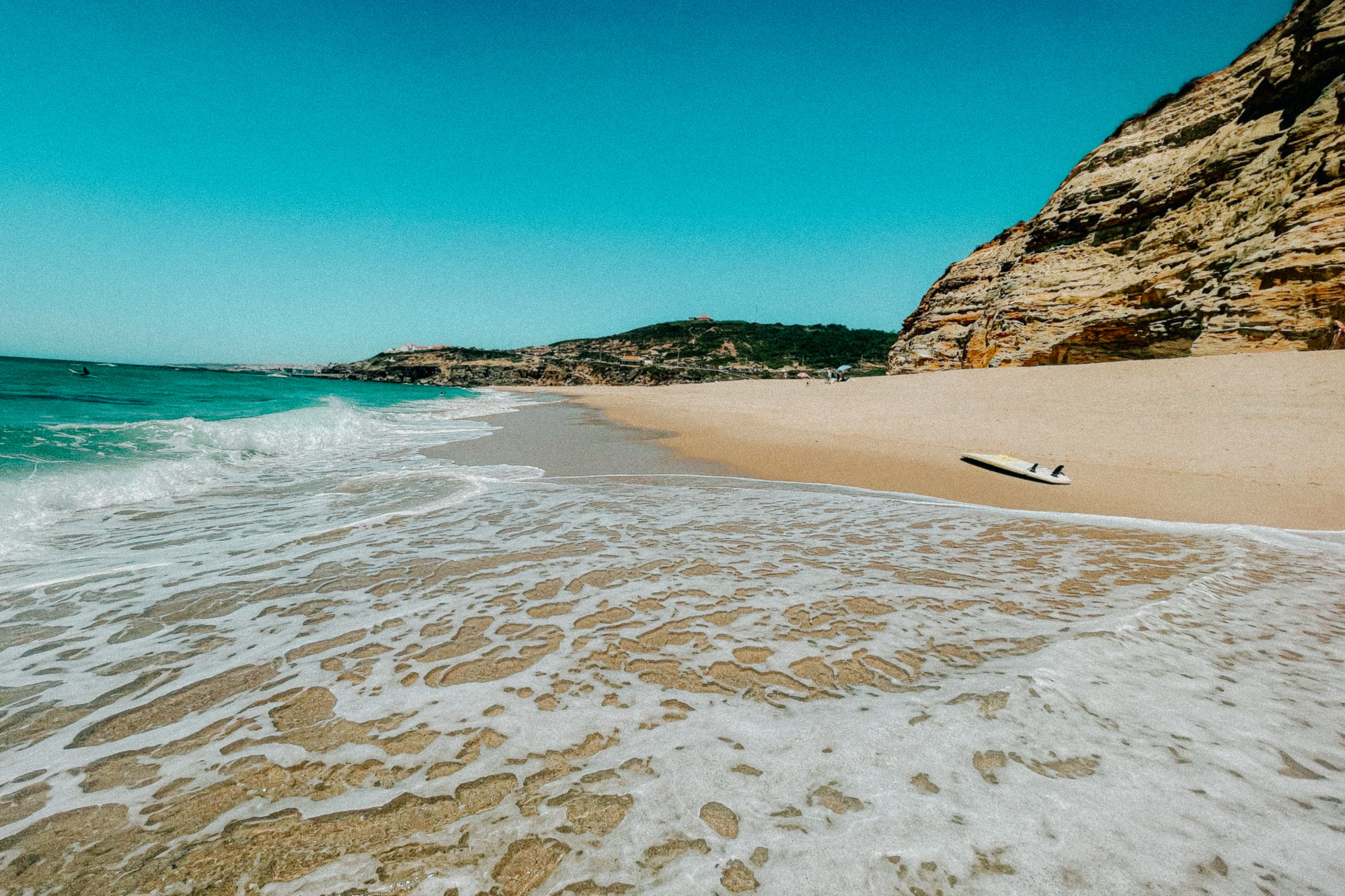 Surfboard on a beach during daytime.