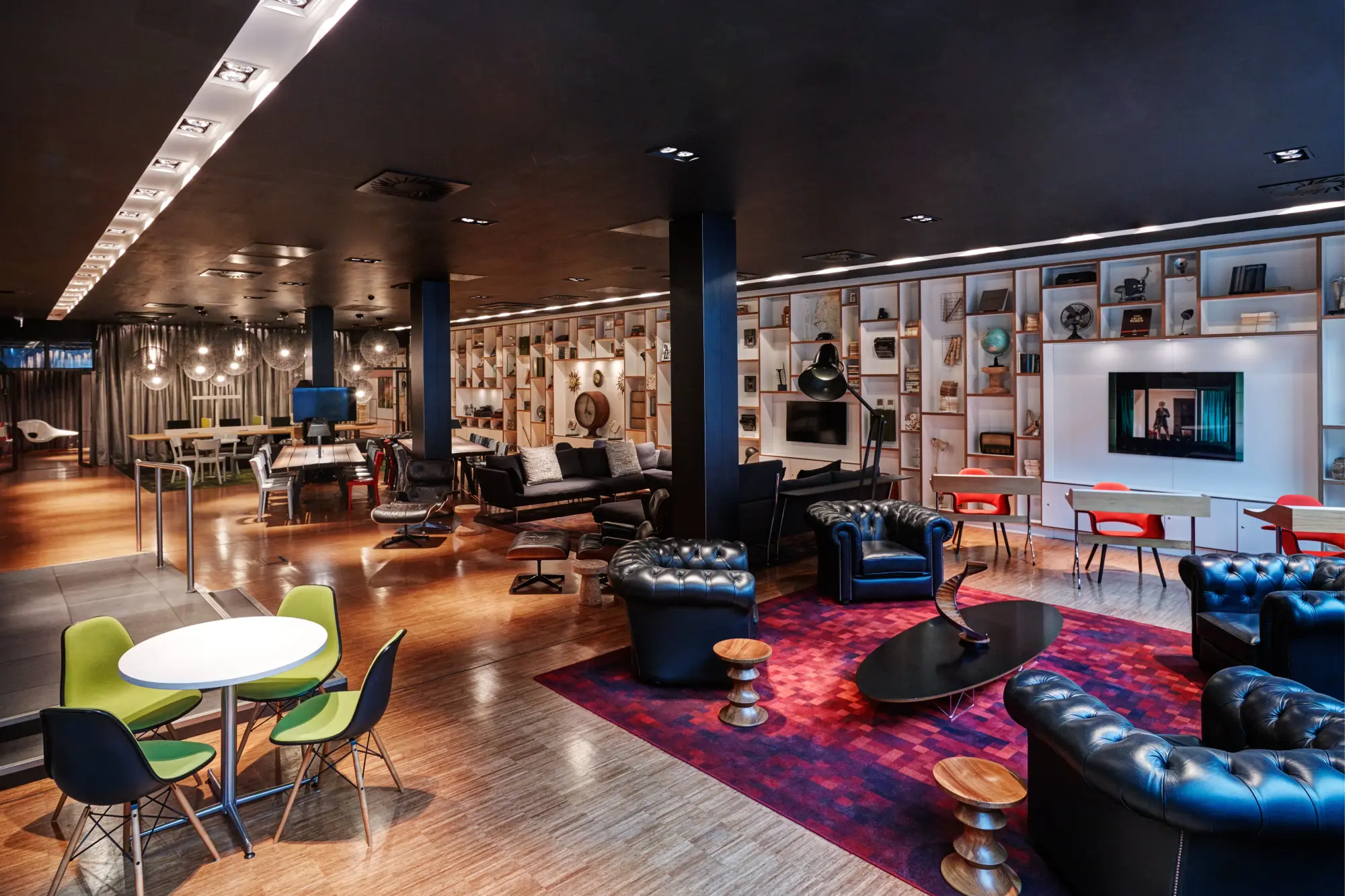 Trendy common space filled with vibrant art, stylish furniture and plenty of seating for socializing