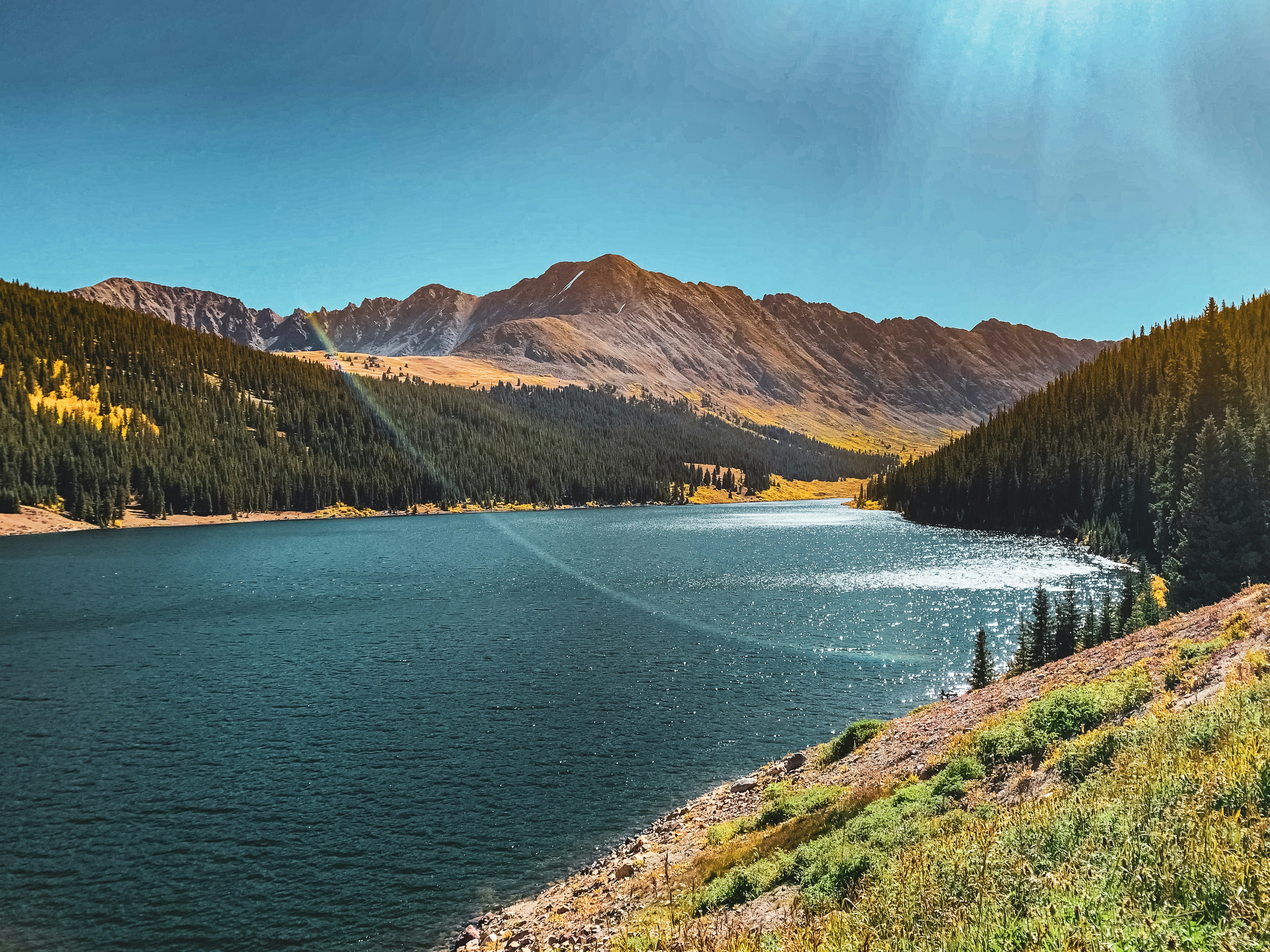 River surrounded by mountain range during the daytime