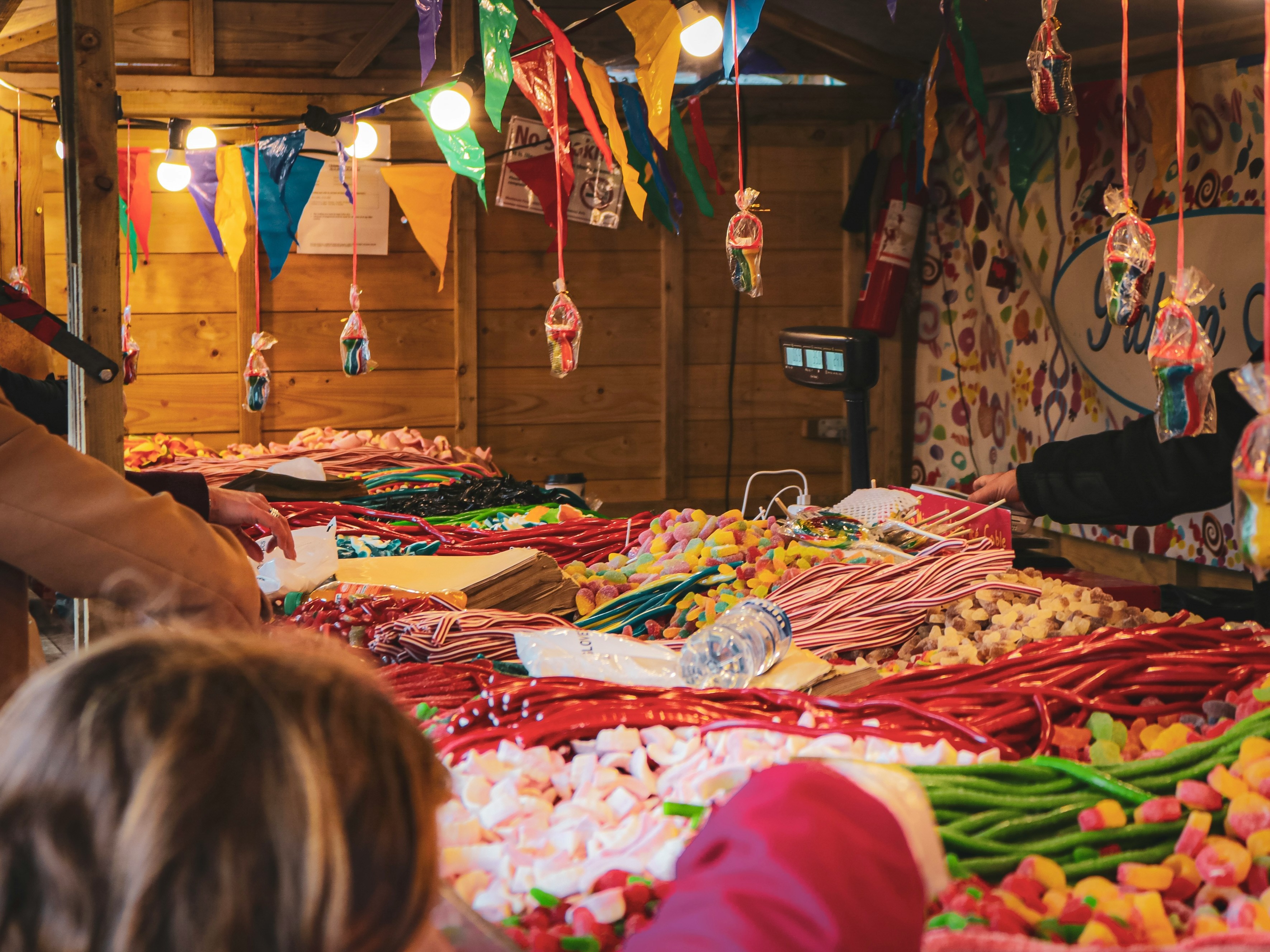 a-woman-and-child-looking-at-candy-at-a-market-ireland-travel-guide