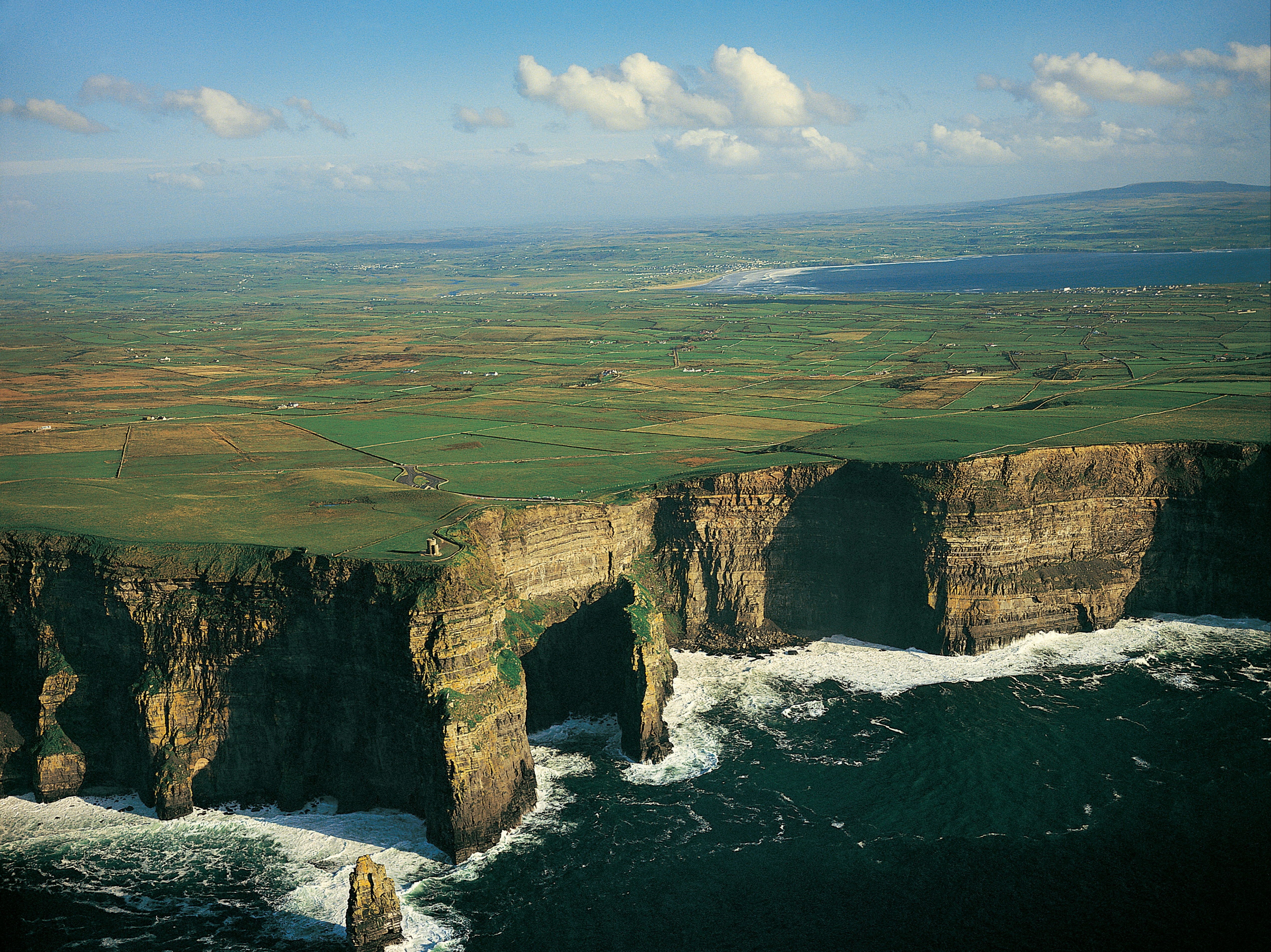 an-aerial-view-of-the-cliffs-and-the-ocean-ireland-travel-guide