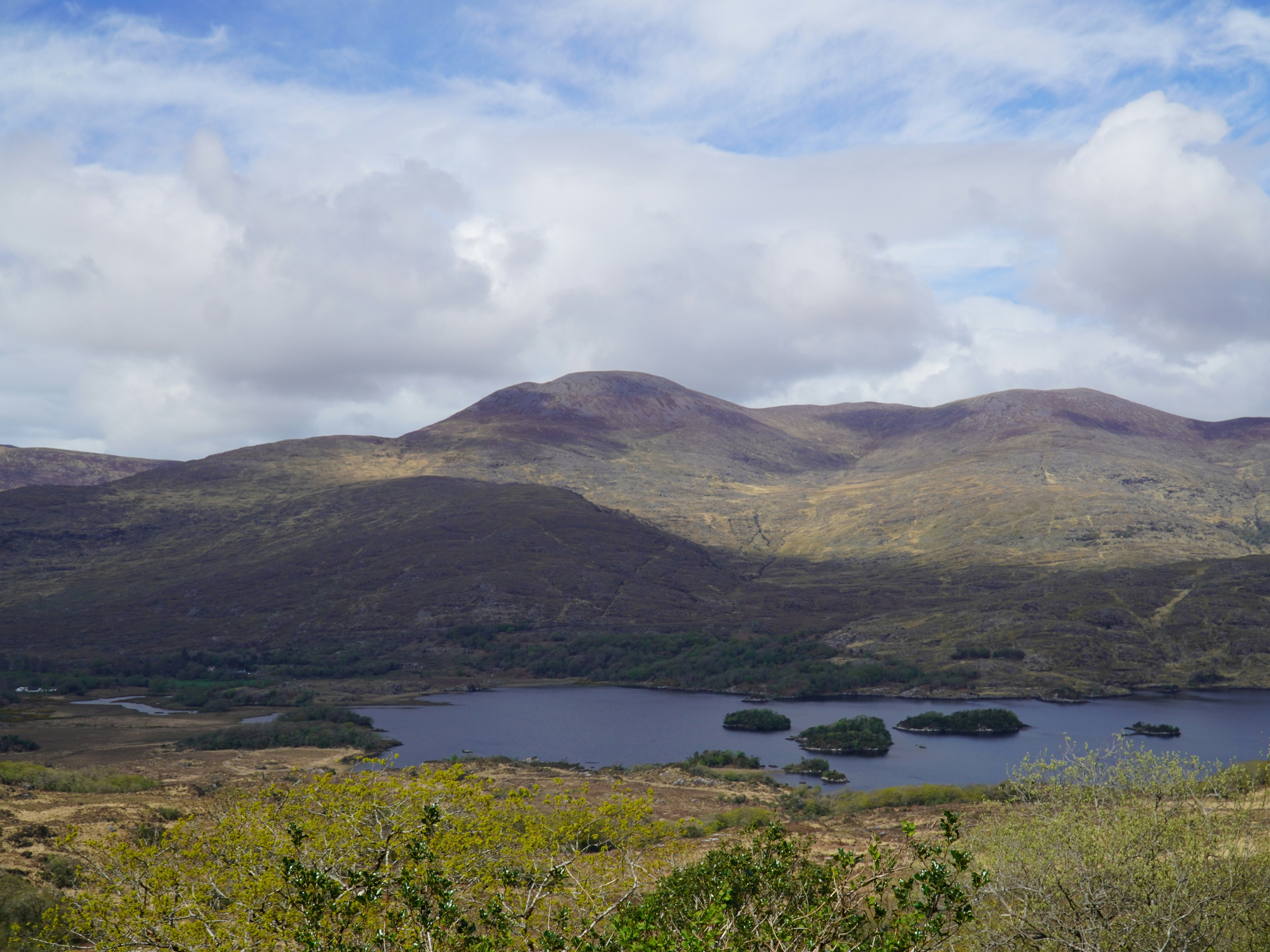 a-lake-surrounded-by-hills-ireland-travel-guide