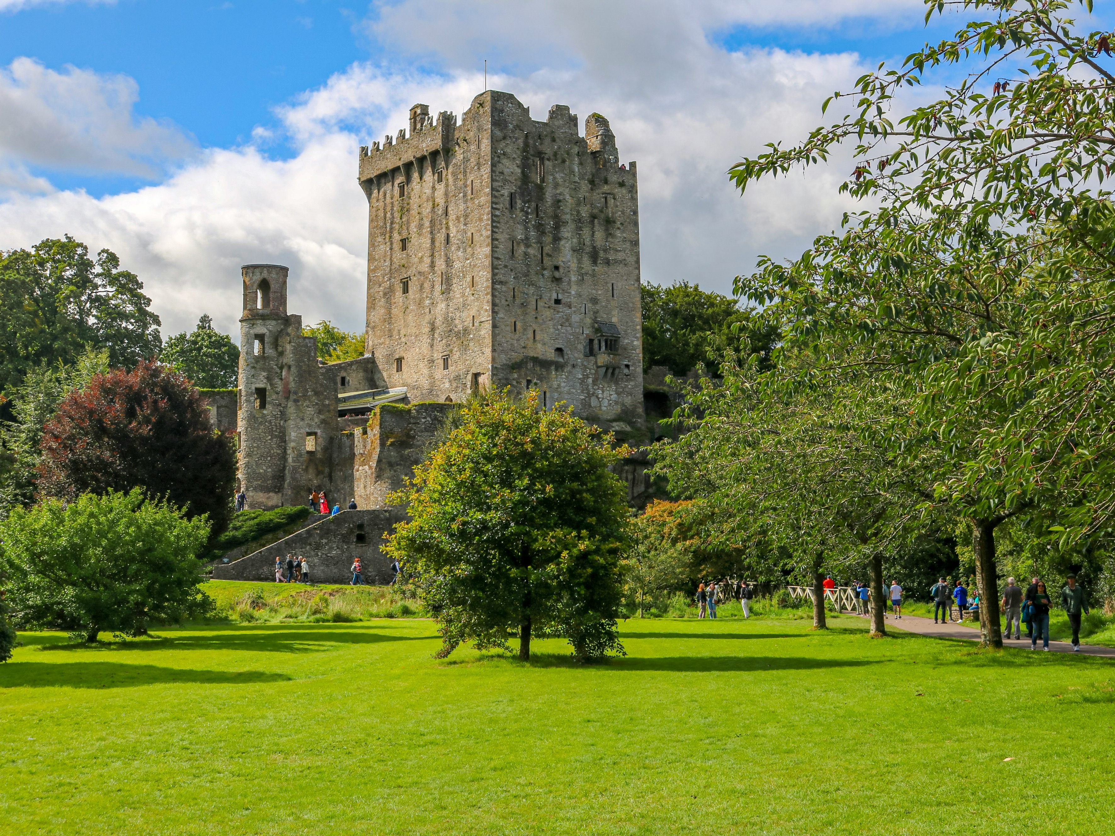a-large-castle-sitting-on-top-of-a-lush-green-field-ireland-travel-guide