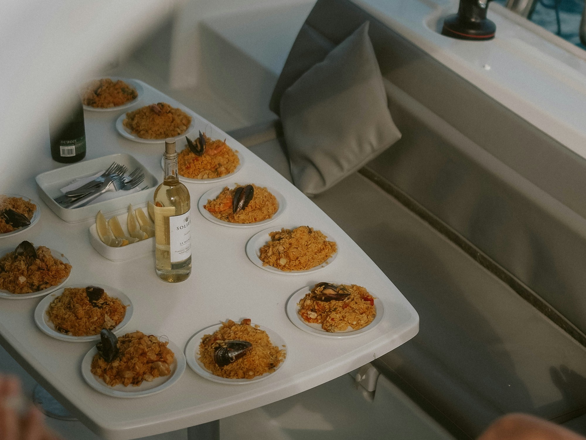 Spanish fare artfully arranged on plates around a table.