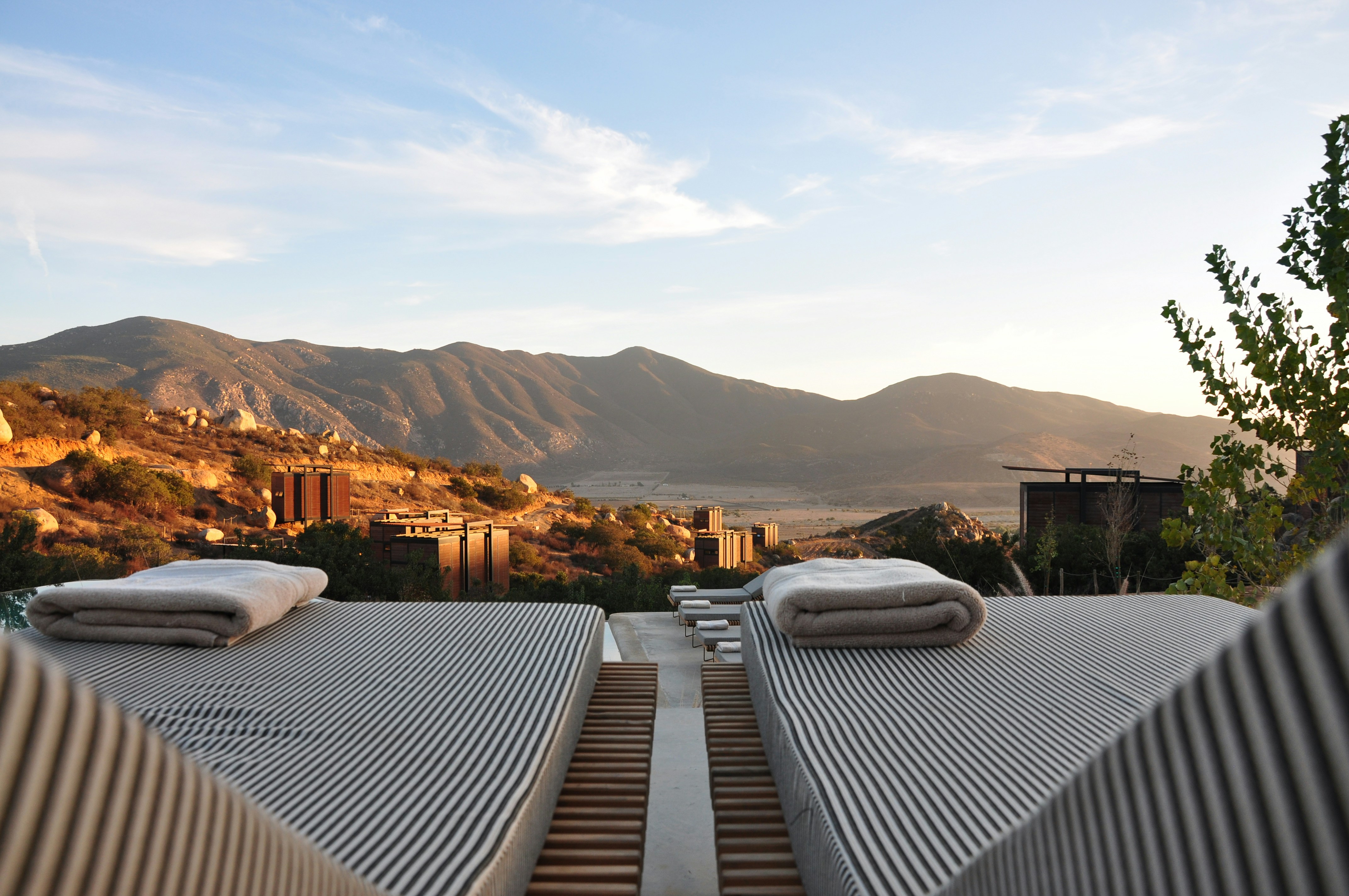 A beautiful view of Palm Springs with luxury loungers on a sunny day.