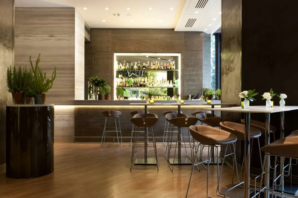 a dining room filled with plants