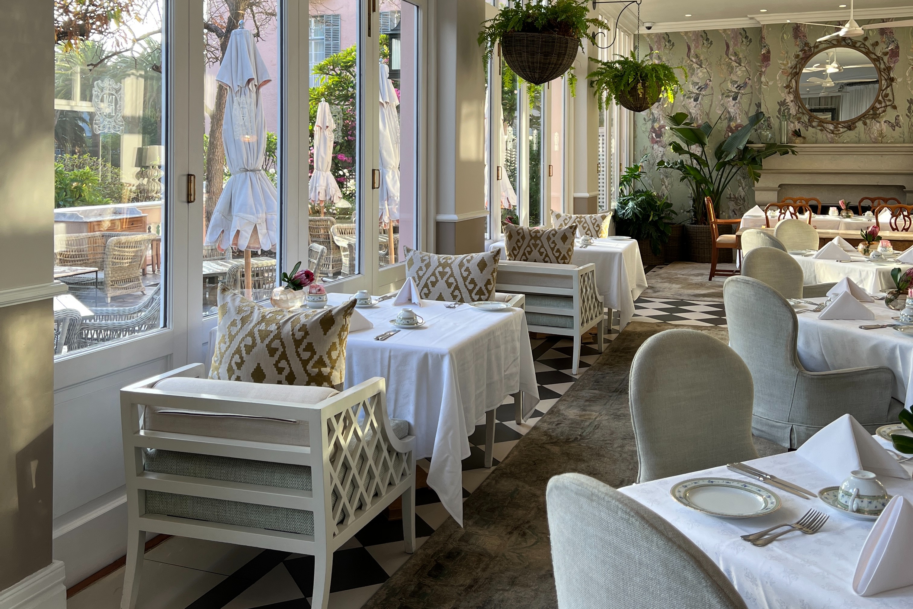 Elegant dining at the Belmond hotel in Cape town with neutral and white furniture
