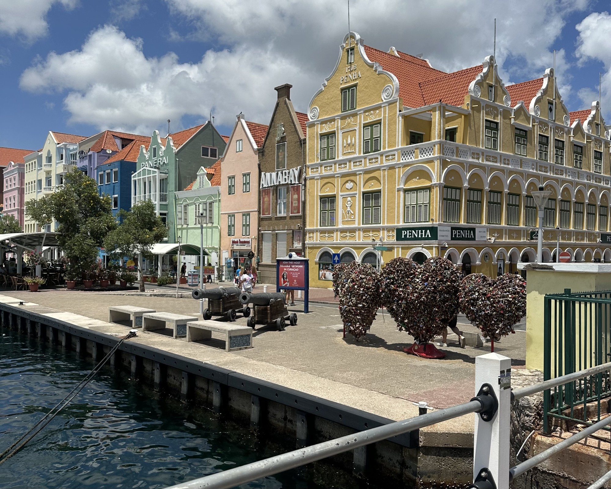 Colorful buildings lined up next to a pier