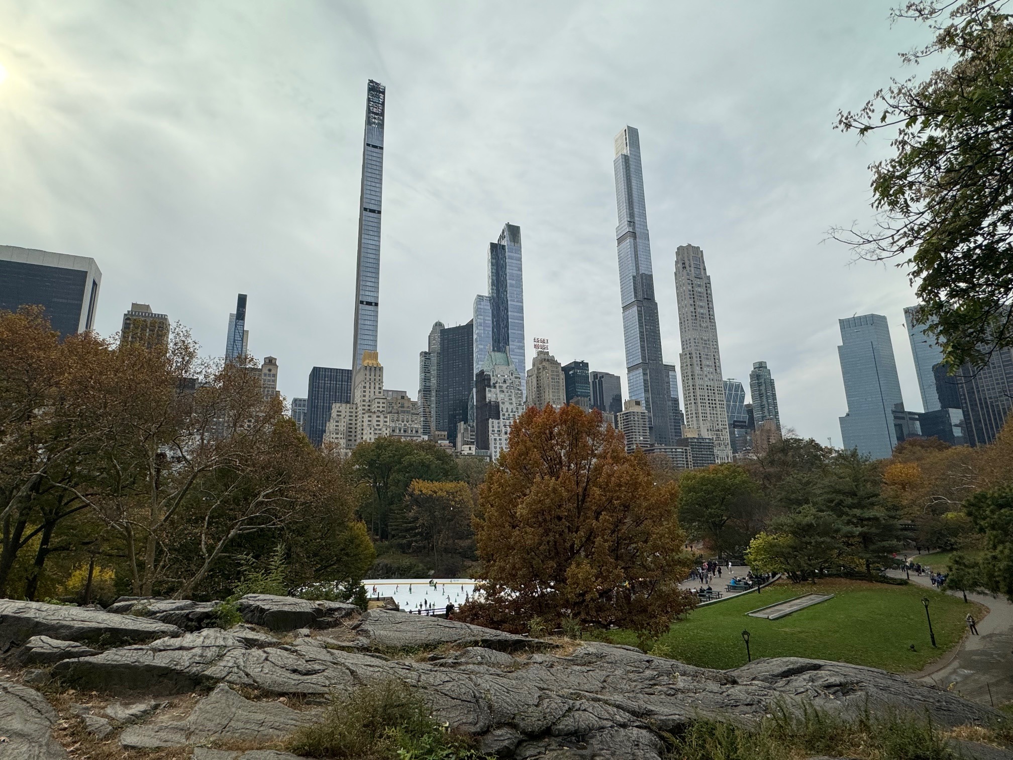 The image showcases Central Park’s greenery against the backdrop of New York’s urban skyscrapers.