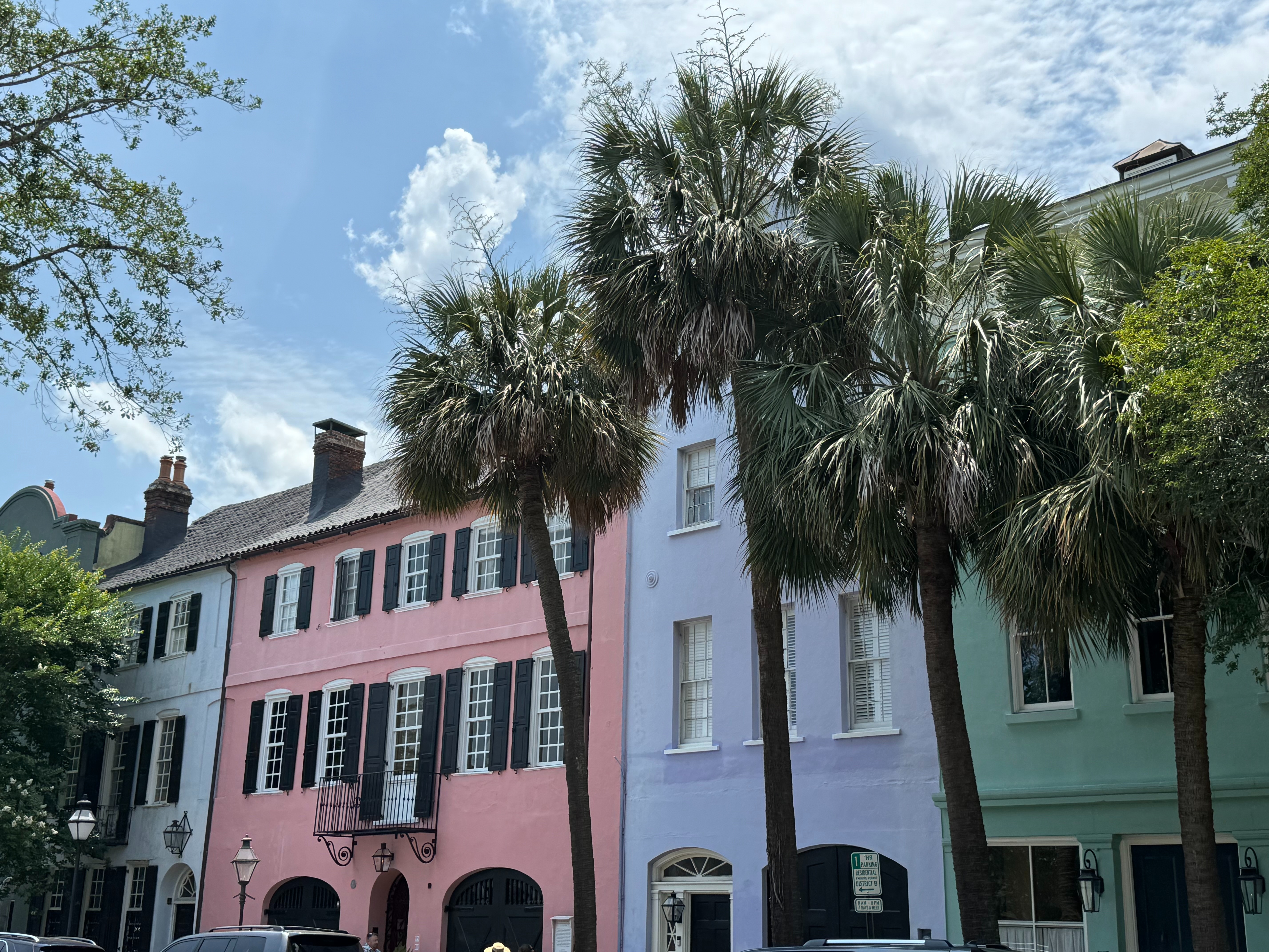 The image displays a charming row of colorful buildings