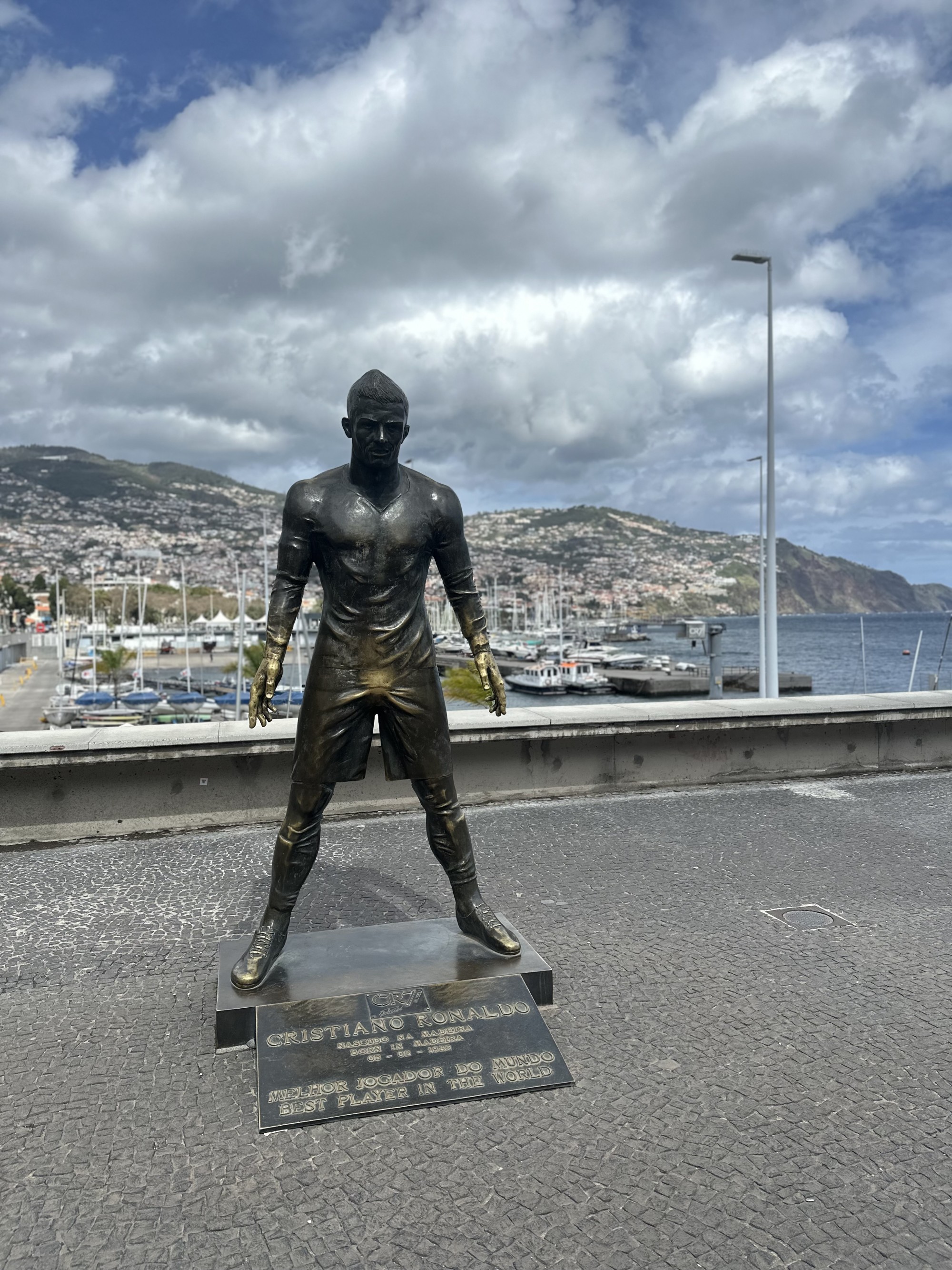 A bronze statue of Cristiano Ronaldo outside of CR7 Museu.