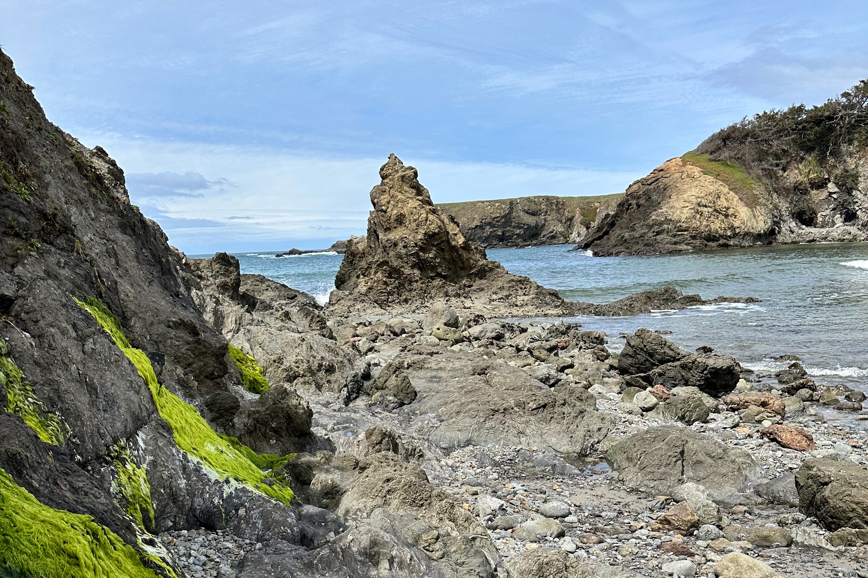 Jug Handle State Natural Reserve's beach area with layered rock formations.