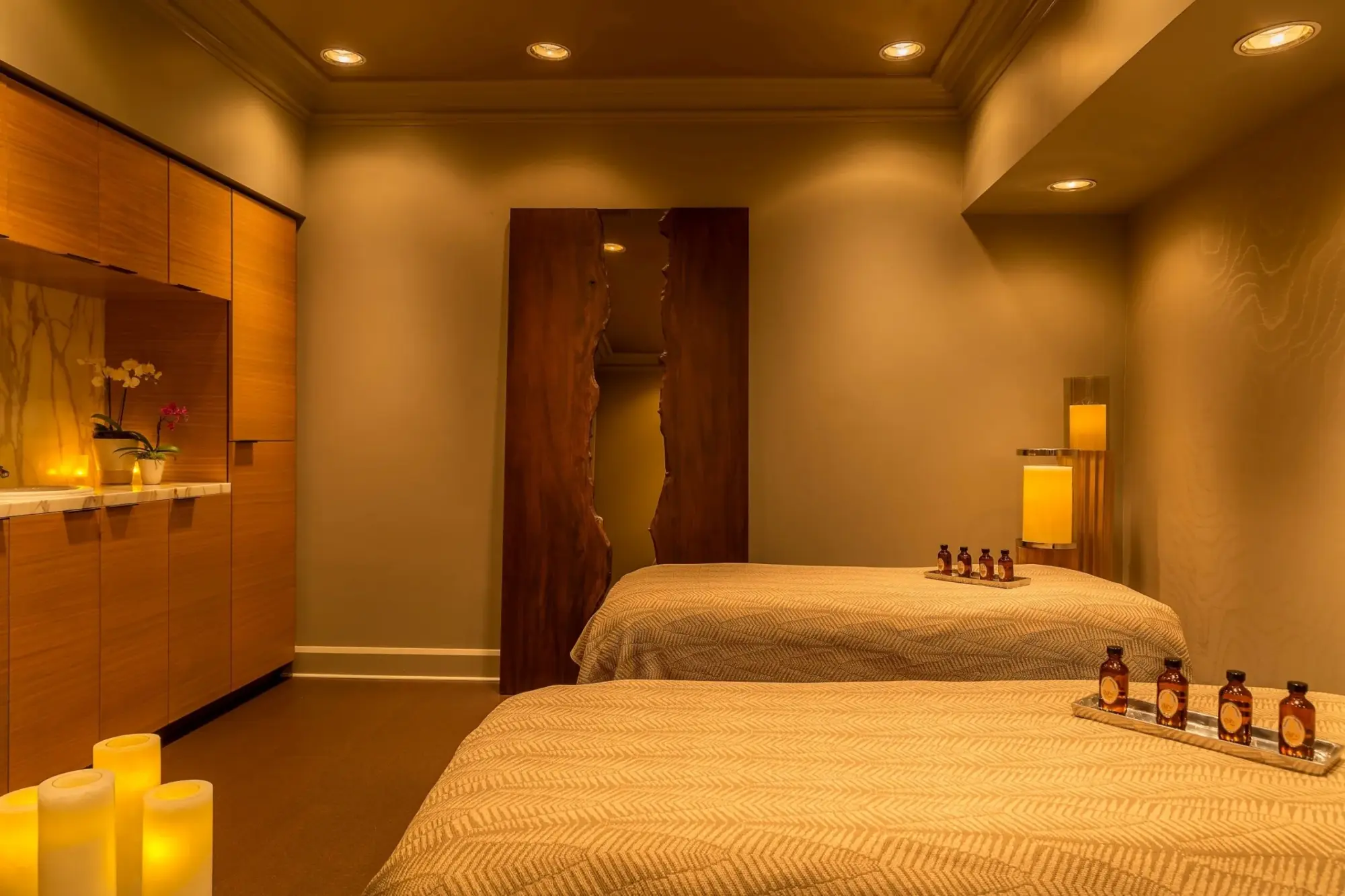 Warm, soft lighting along with natural hues and inspired furnishings create a calming atmosphere